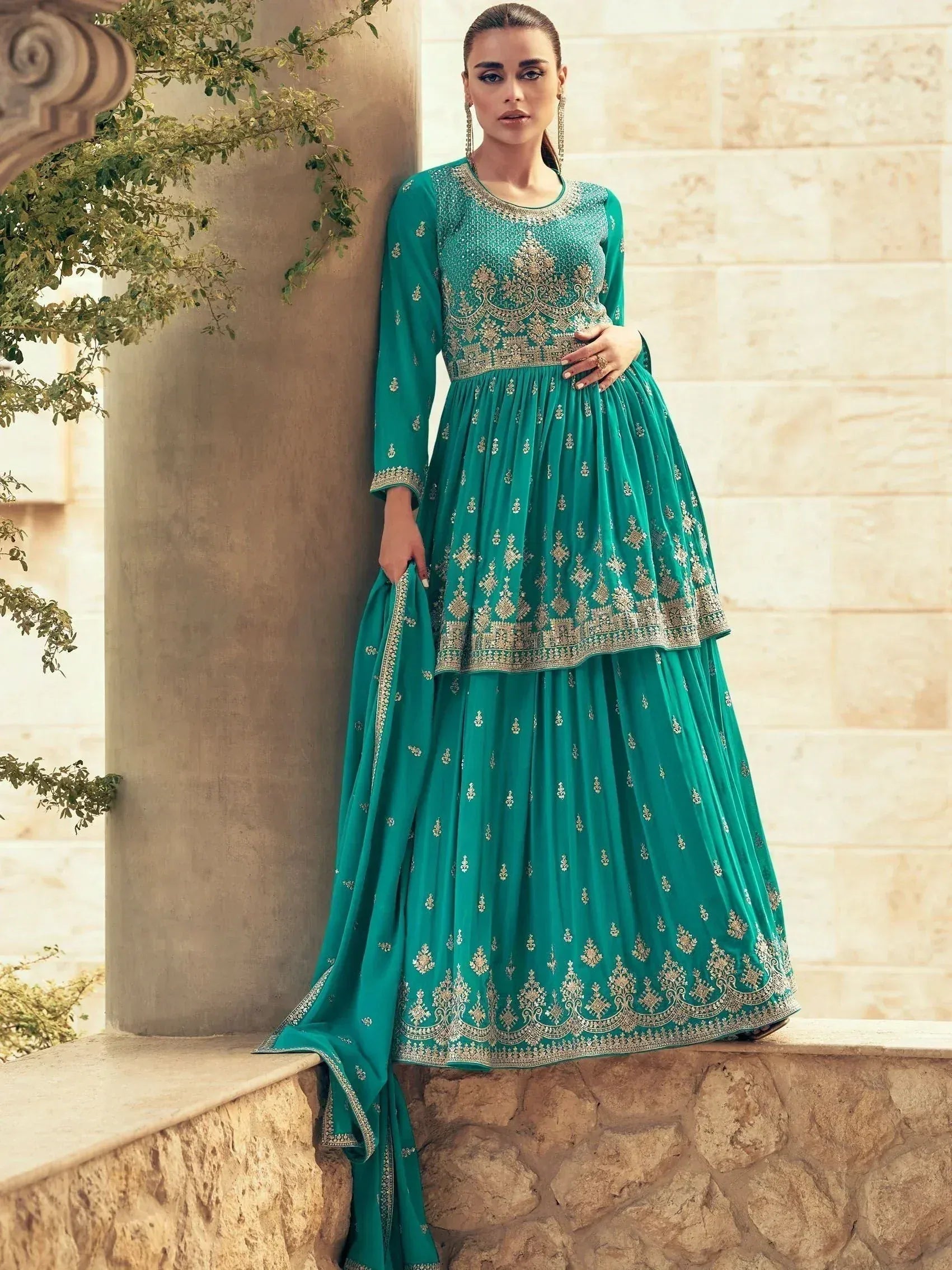 Emerald green embroidered anarkali suit with gold detailing, perfect for Indian ethnic occasions