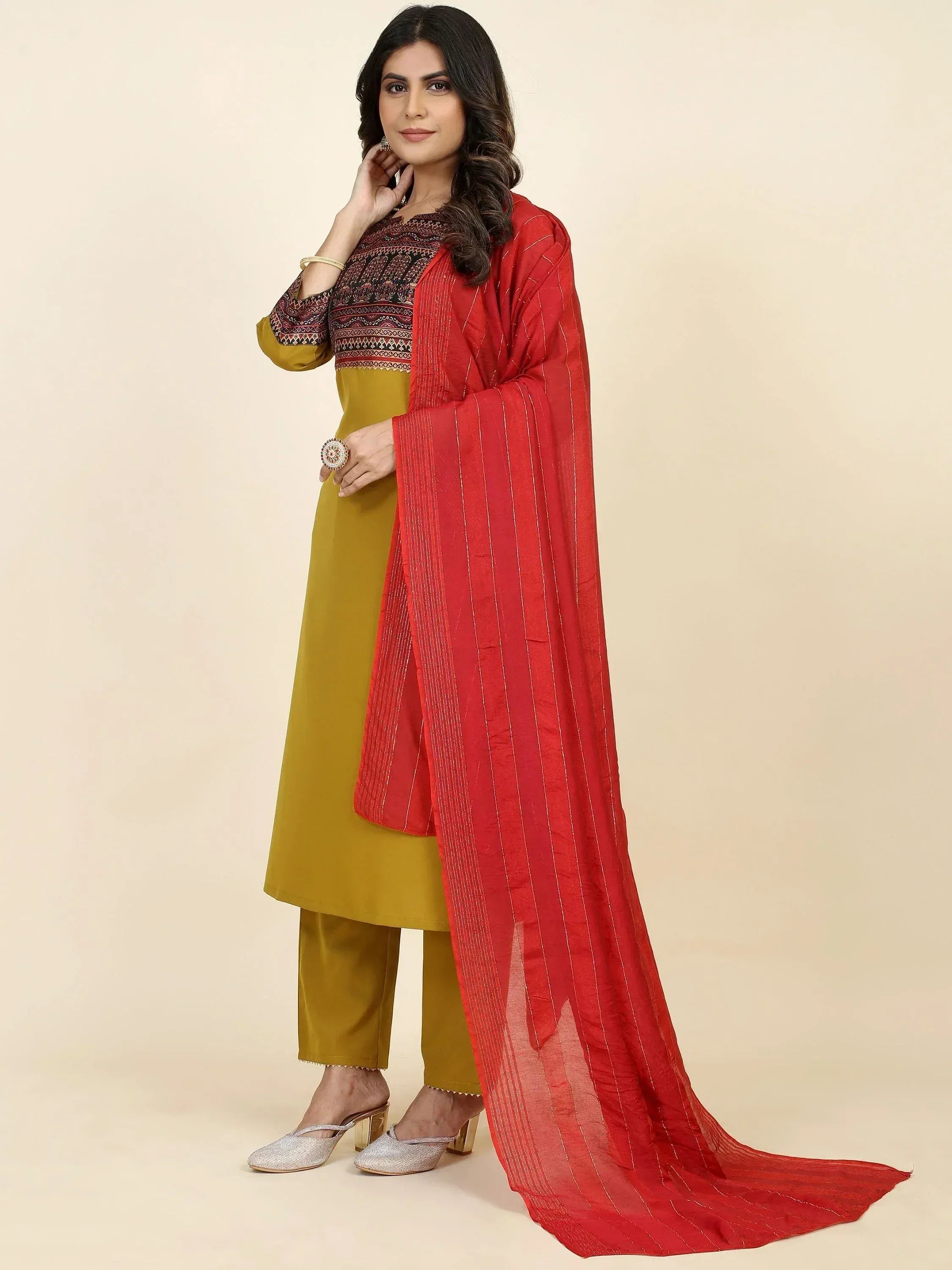 Stylish mustard salwar kameez with red dupatta, perfect for ethnic occasions