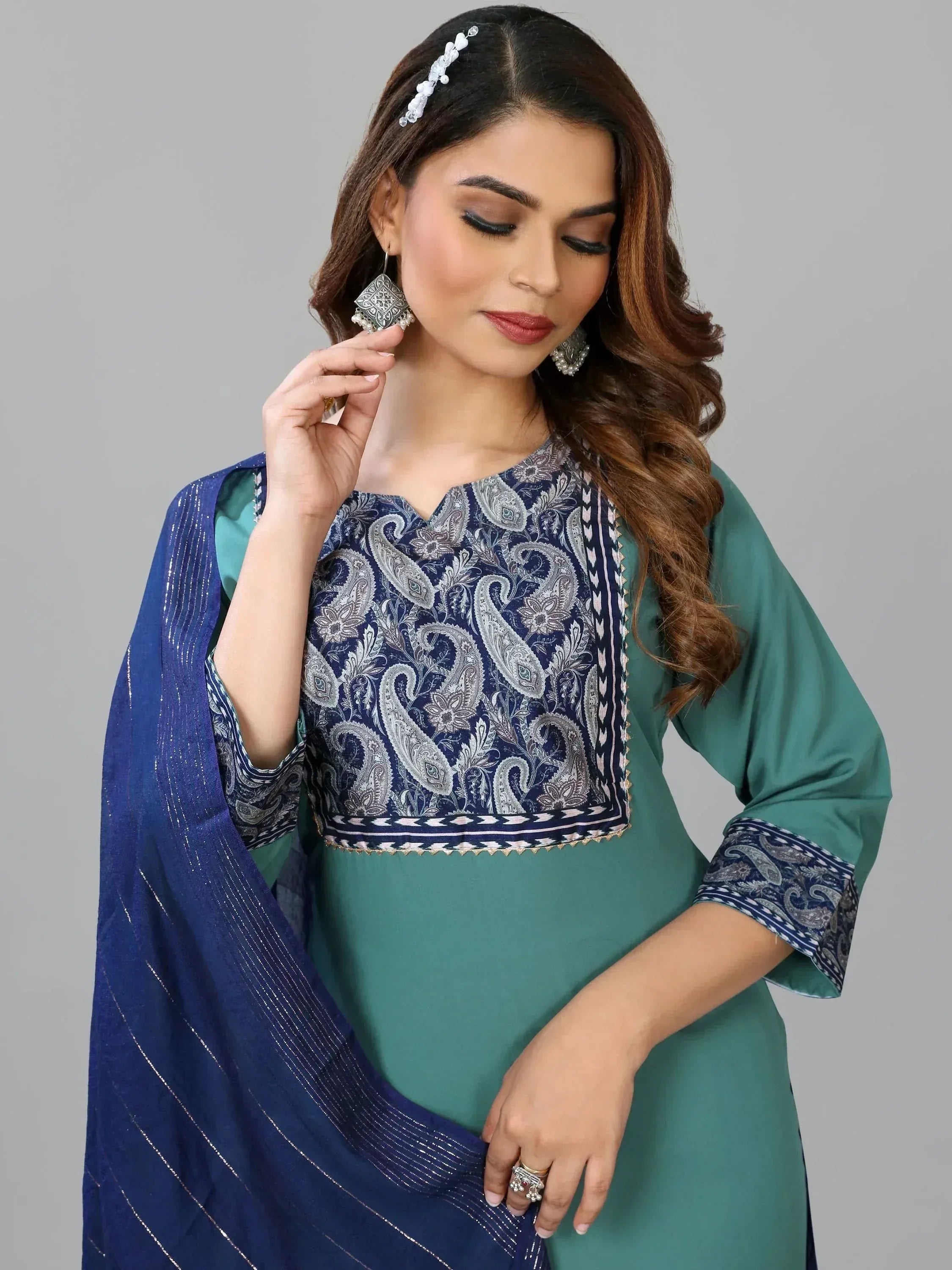 Woman in green and navy blue paisley print salwar kameez with matching dupatta, ethnic wear