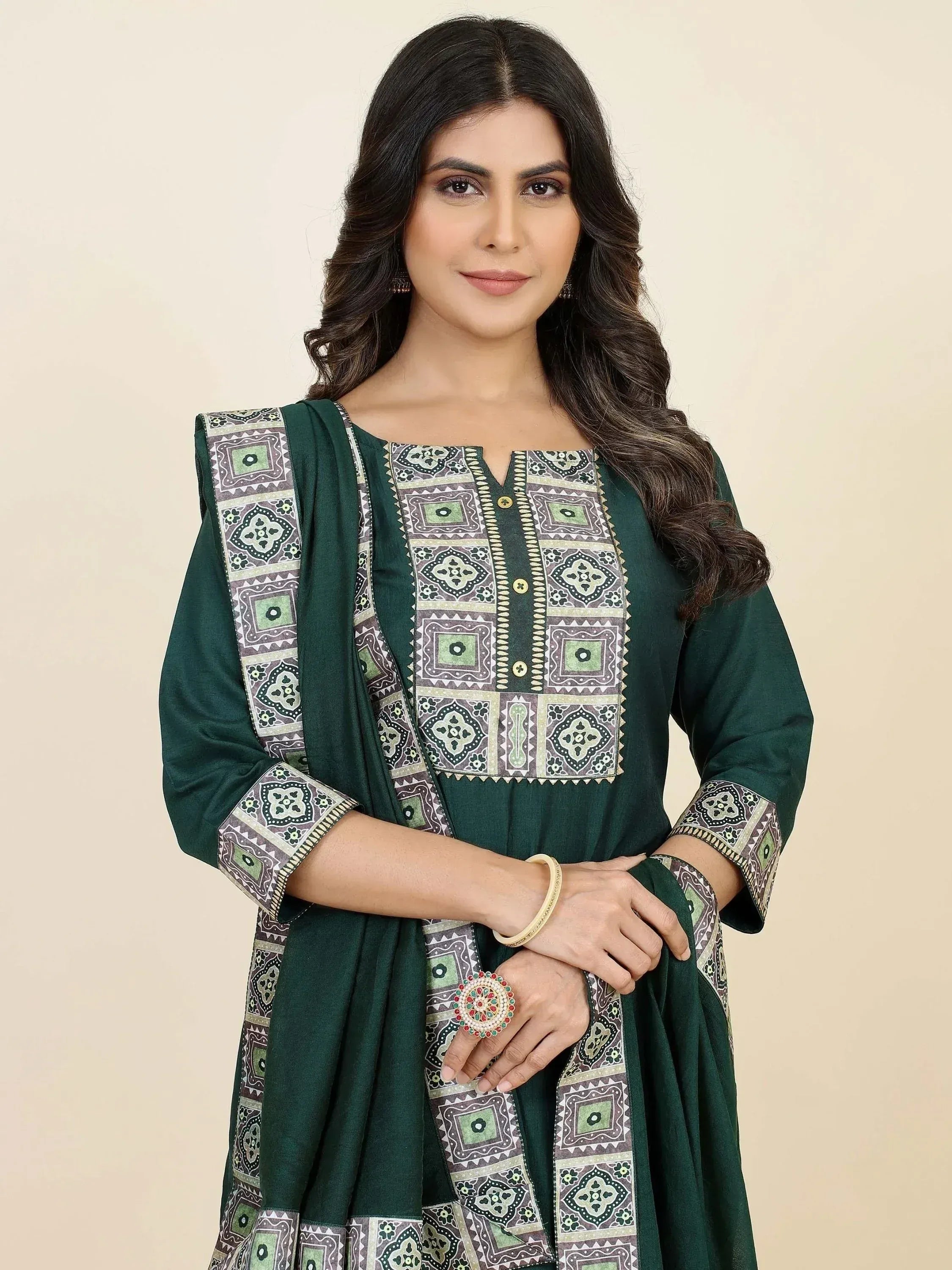 Green printed salwar kameez with ethnic geometric patterns, perfect for Indian ethnic wear