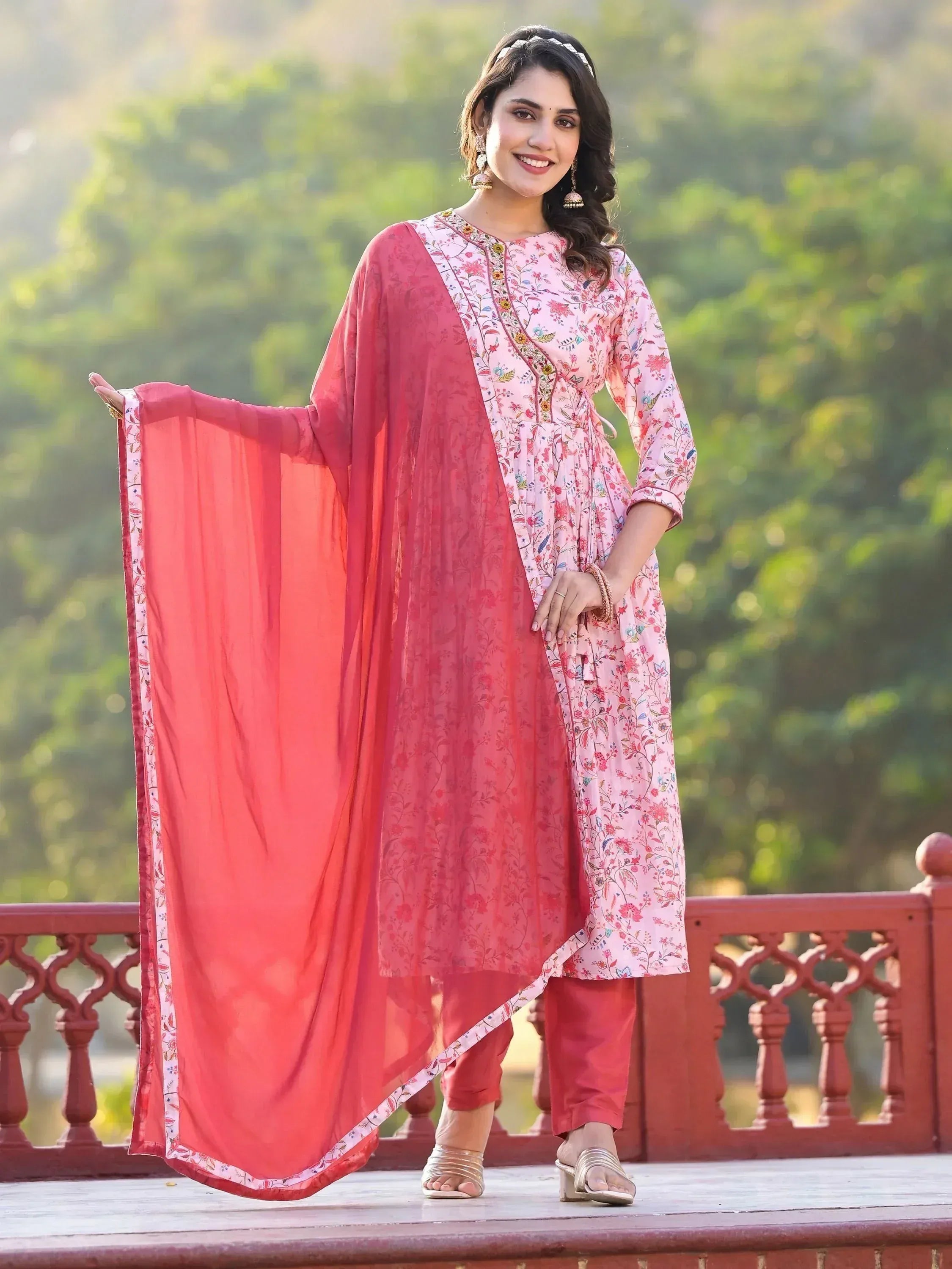Woman in floral pink kurta with red dupatta, ethnic Indian wear for festive occasions