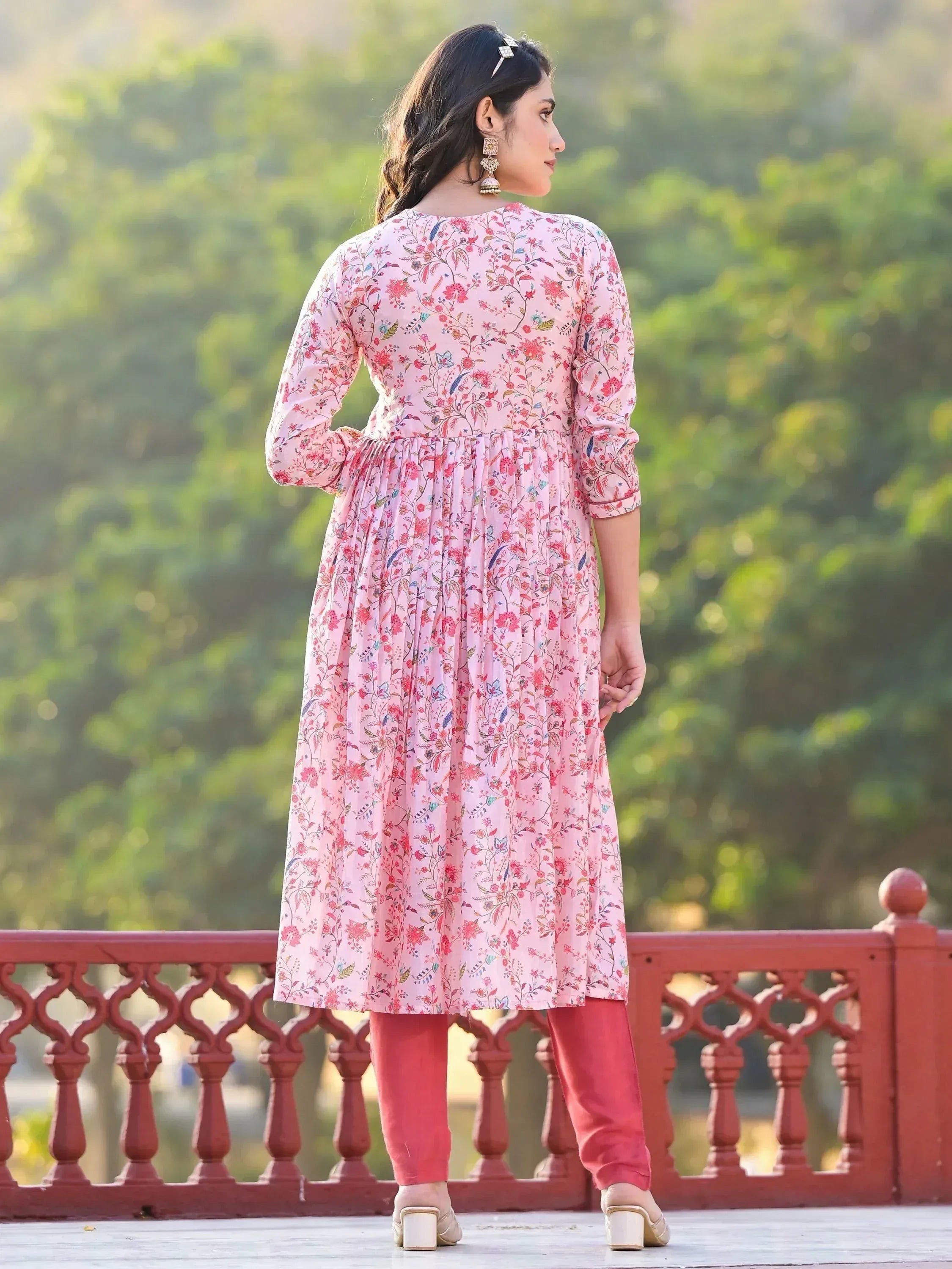 Pink floral printed kurta with red pants, ethnic wear for women, garden setting