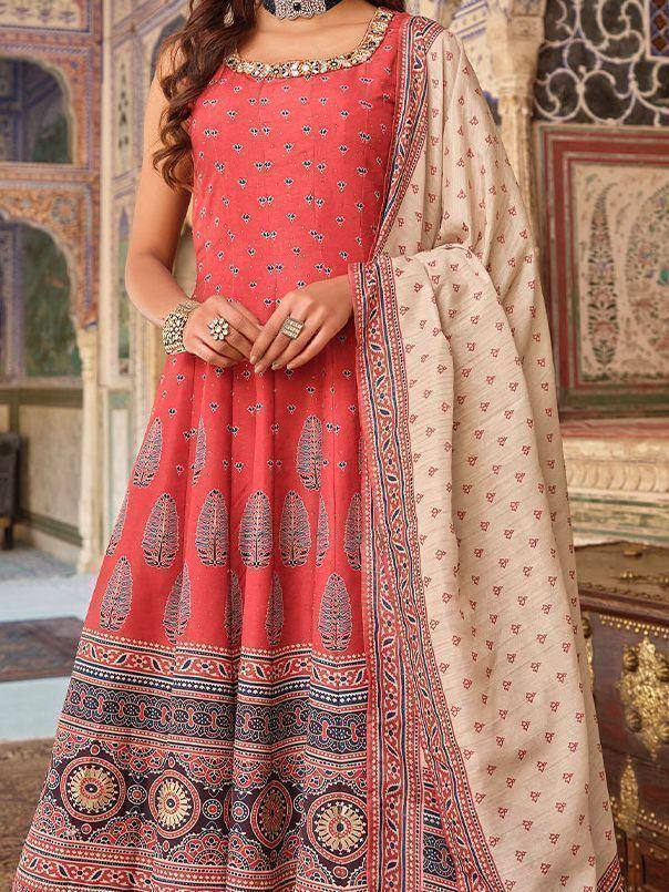 Red printed anarkali suit with ethnic embroidery and dupatta, perfect for Indian occasions