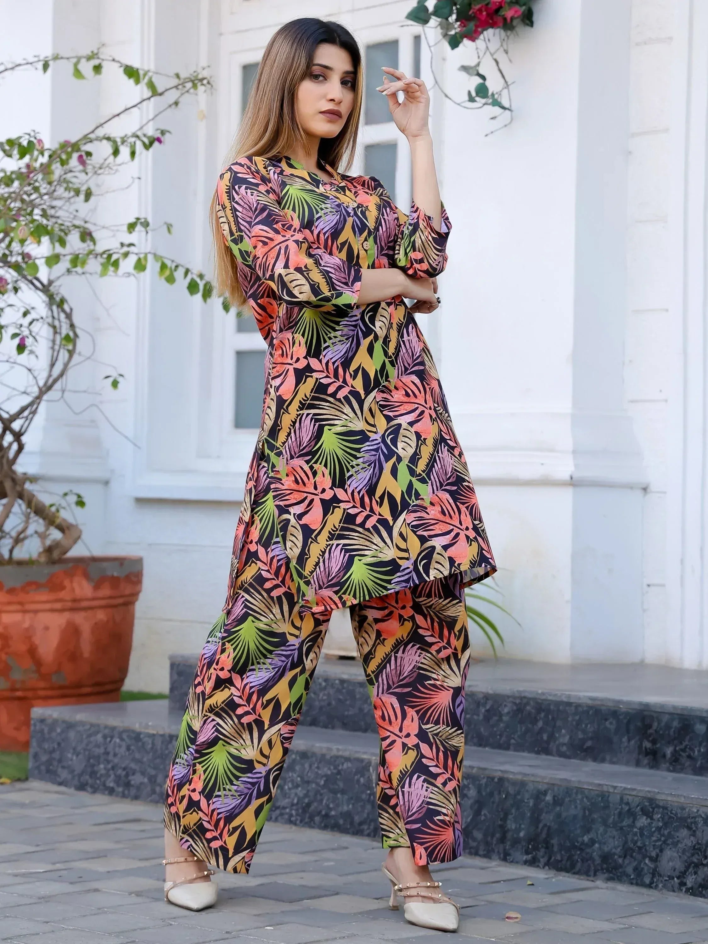 Woman in vibrant tropical print salwar kameez, stylish ethnic wear for women