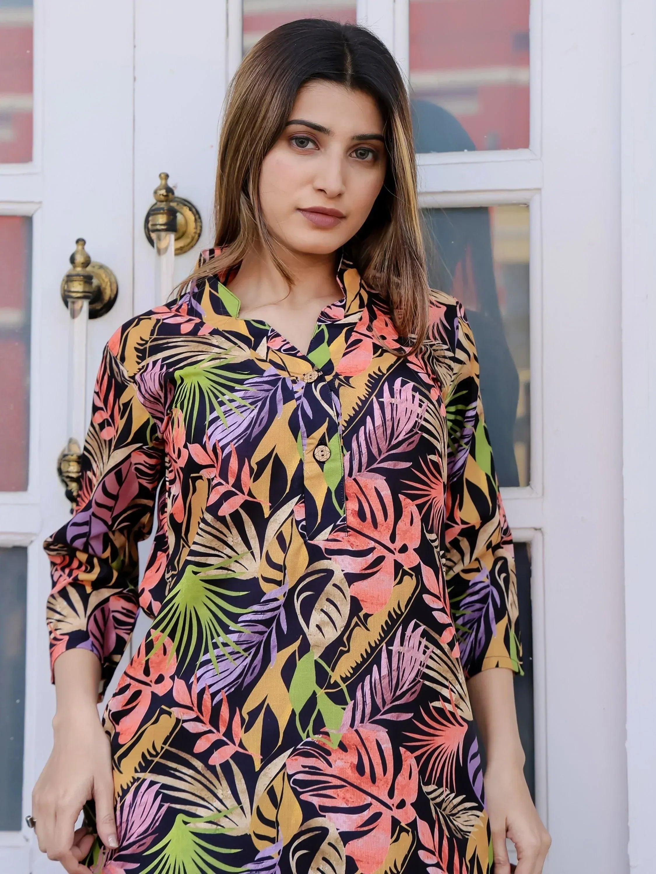 Woman in colorful tropical print ethnic kurti with leaf pattern, stylish Indian wear