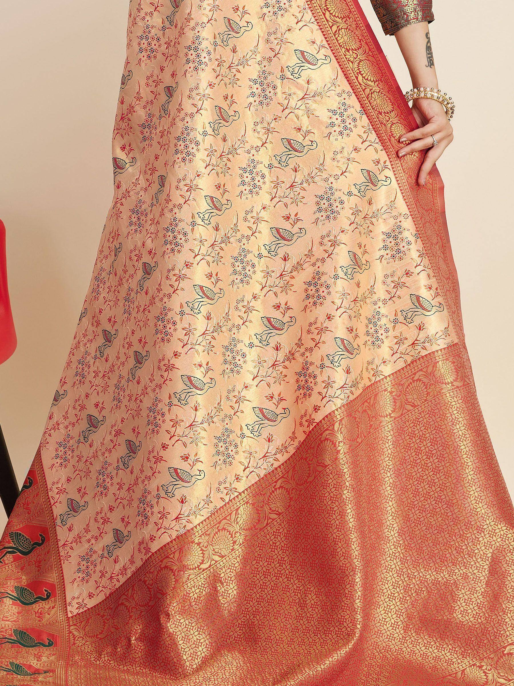 Elegant peach saree with bird and floral print, red gold border, perfect for Indian ethnic wear