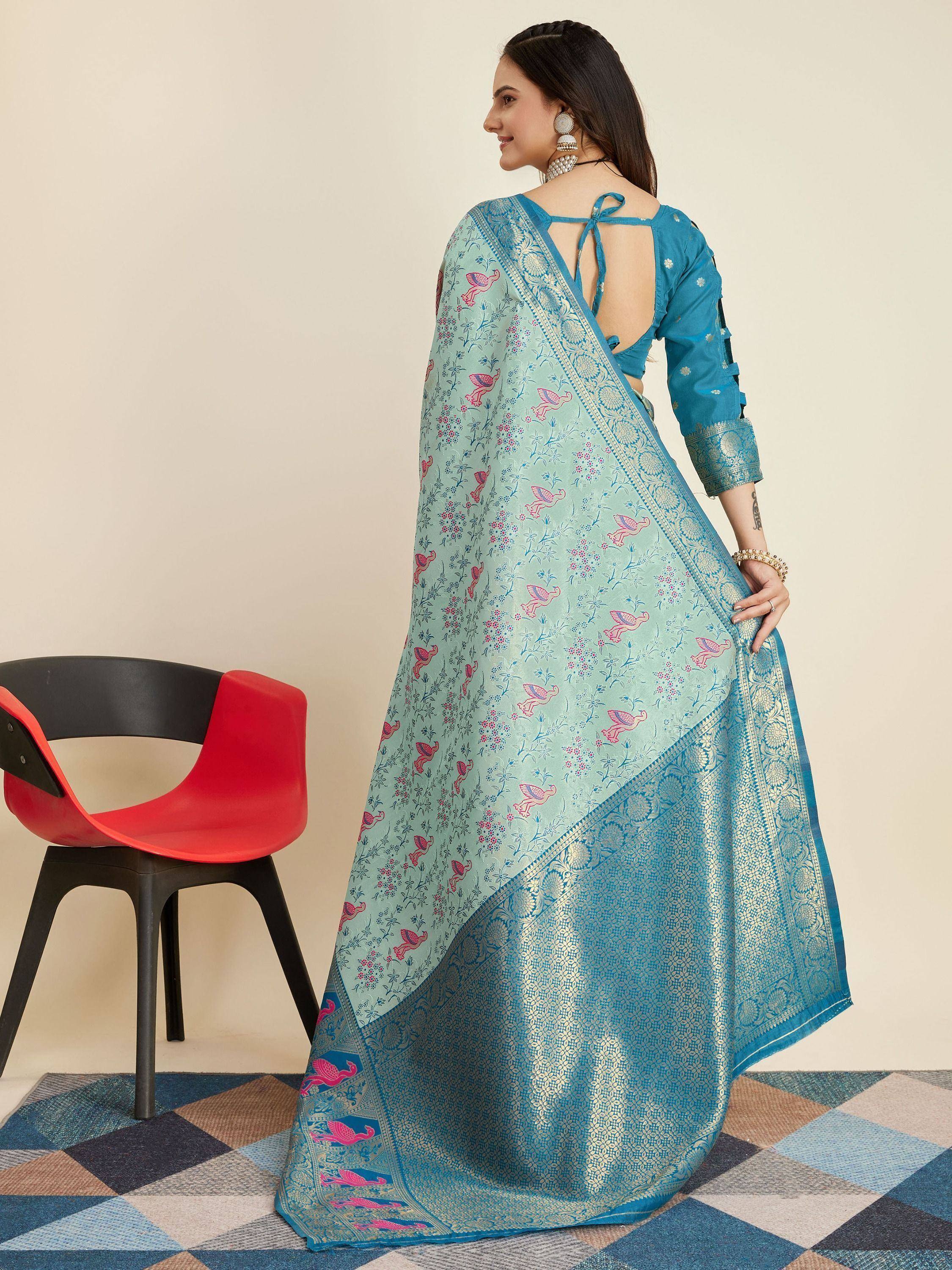 Blue printed saree with pink bird motifs and gold border, paired with matching blouse, ideal for ethnic occasions.