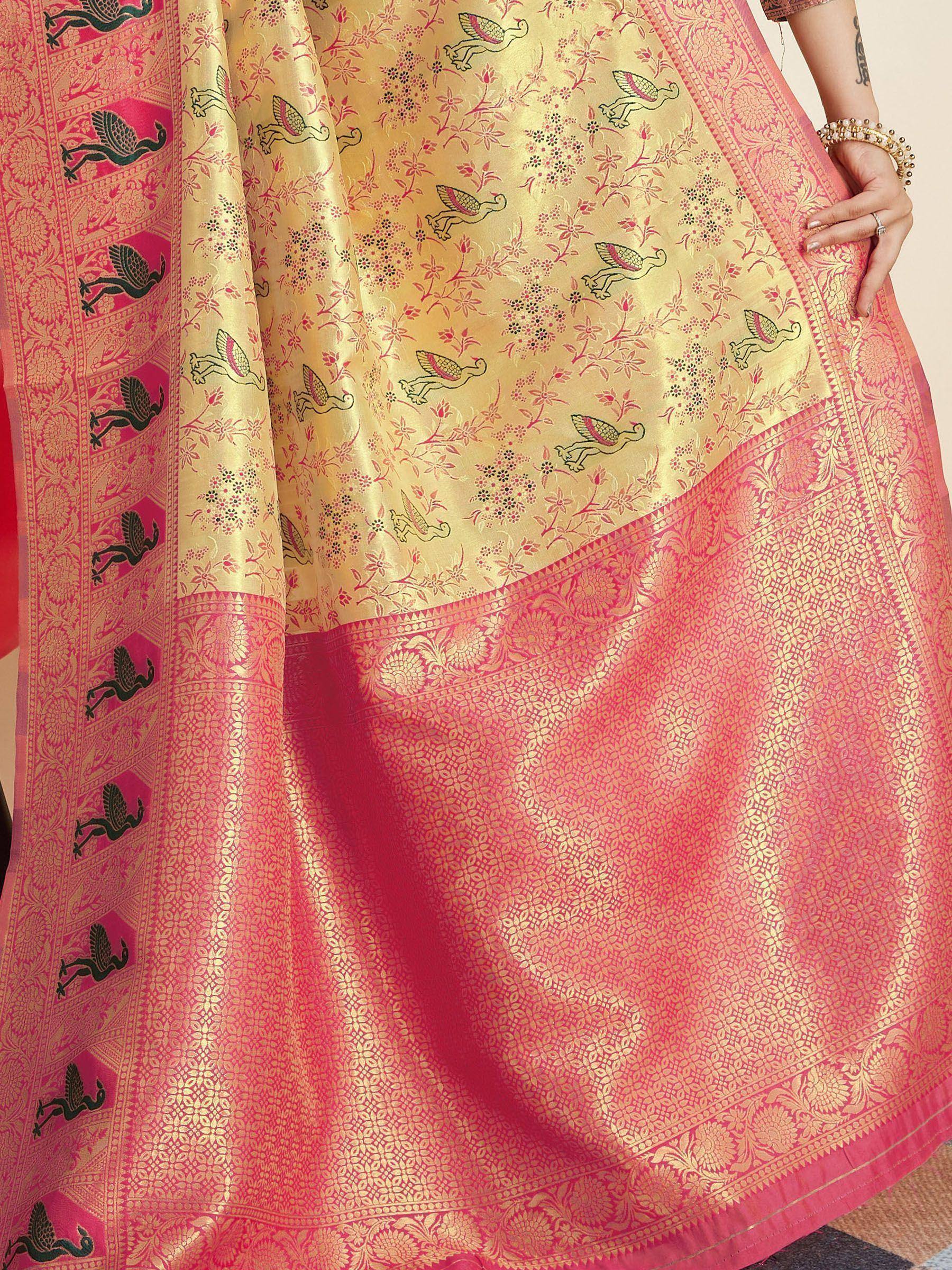 Pink and gold Banarasi saree with peacock motifs and floral zari work, traditional Indian ethnic wear