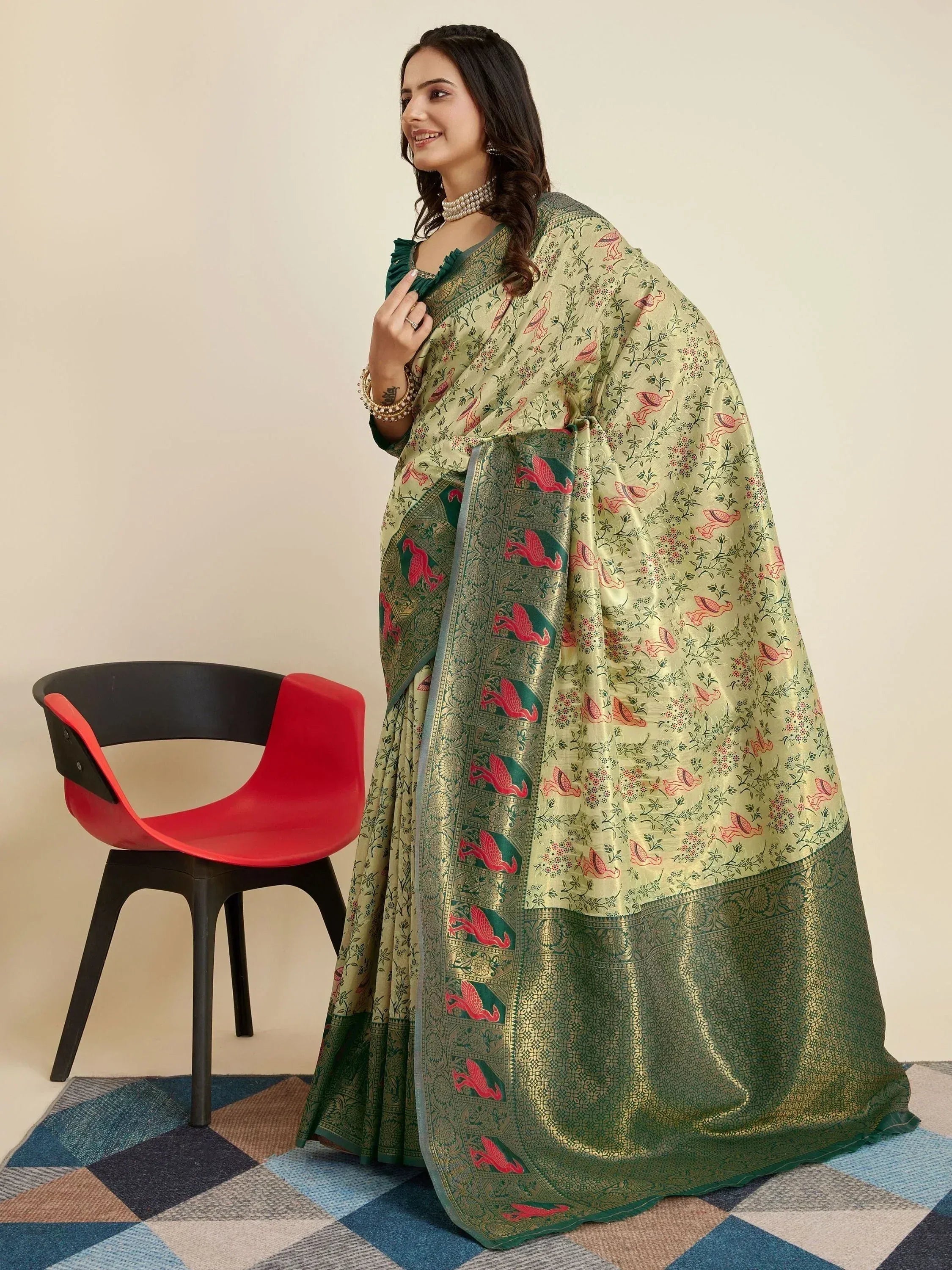 Elegant green saree with floral and bird motifs, perfect for ethnic occasions
