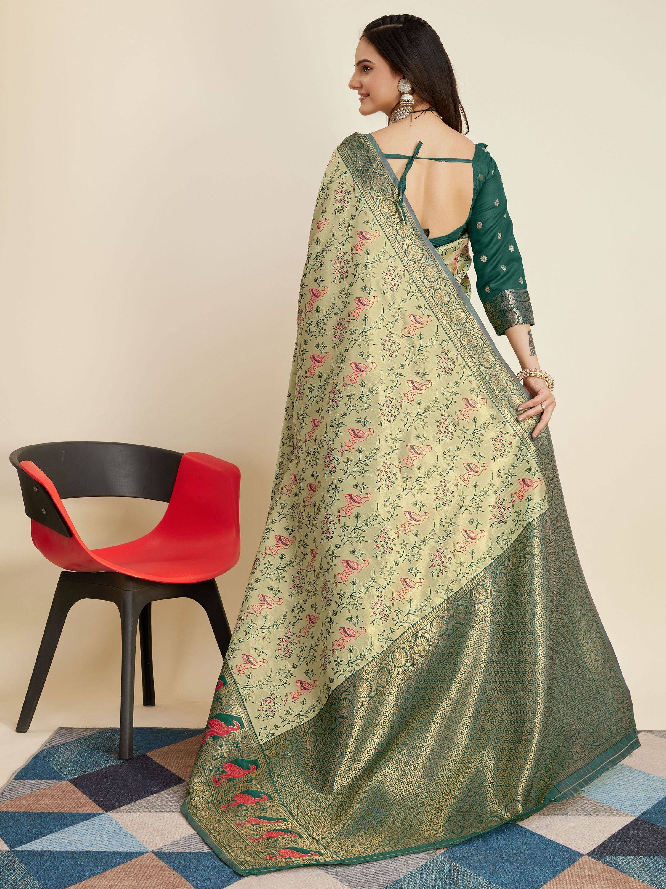Elegant green saree with floral and bird motifs, paired with a designer blouse for ethnic wear.