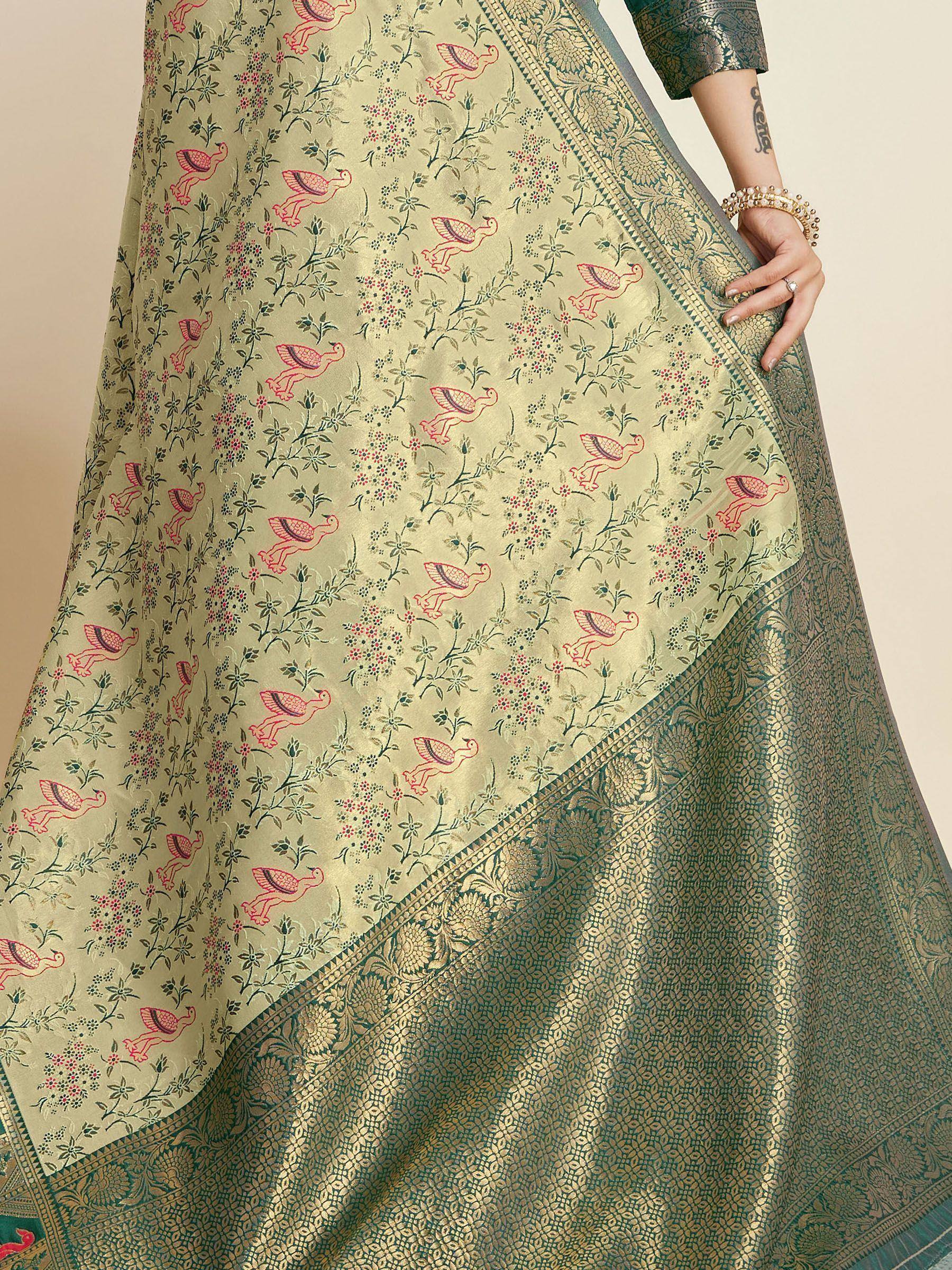 Elegant green saree with pink bird and floral print, golden border, perfect for ethnic wear