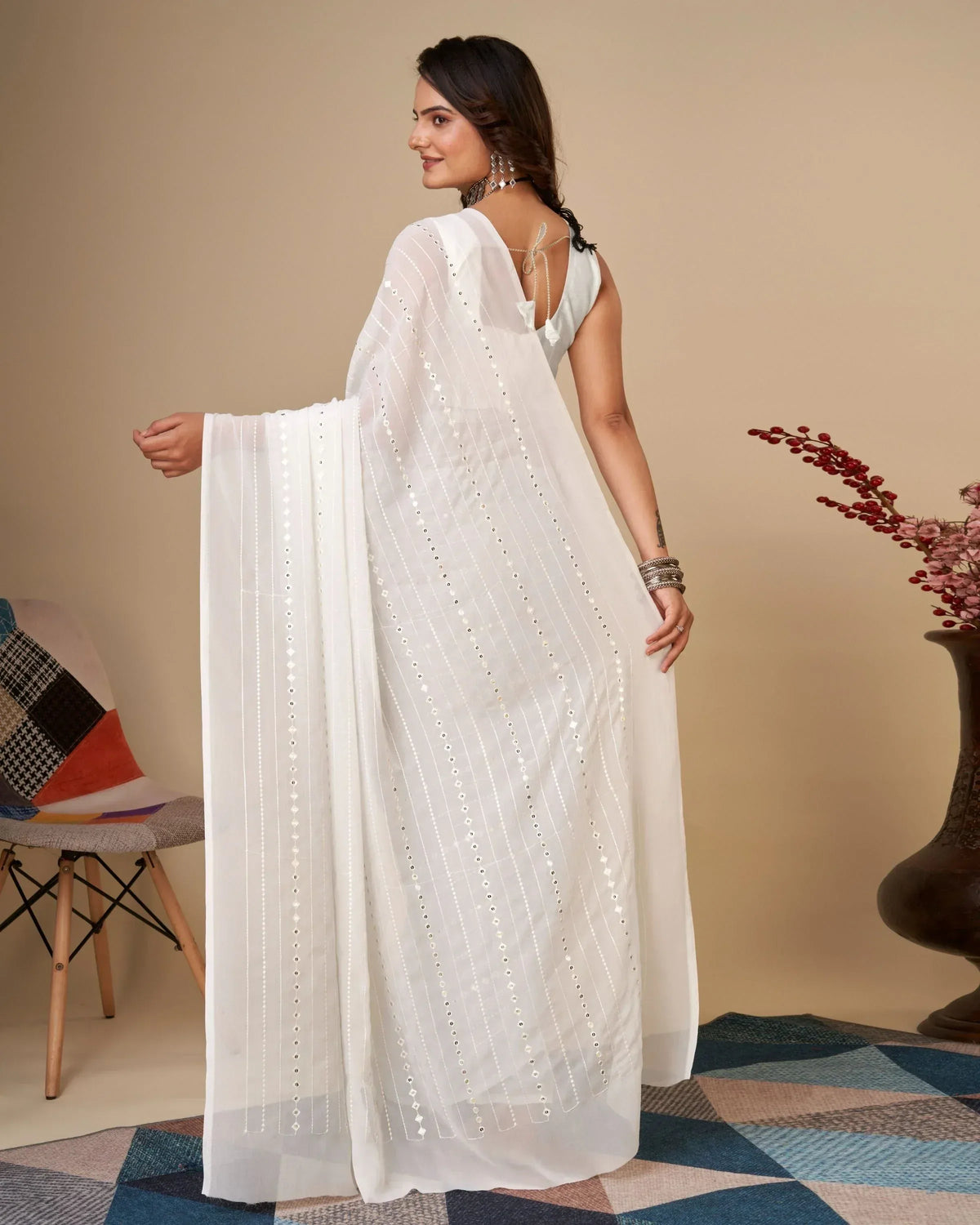 White ethnic gown with mirror work and sheer dupatta, perfect for Indian festive occasions