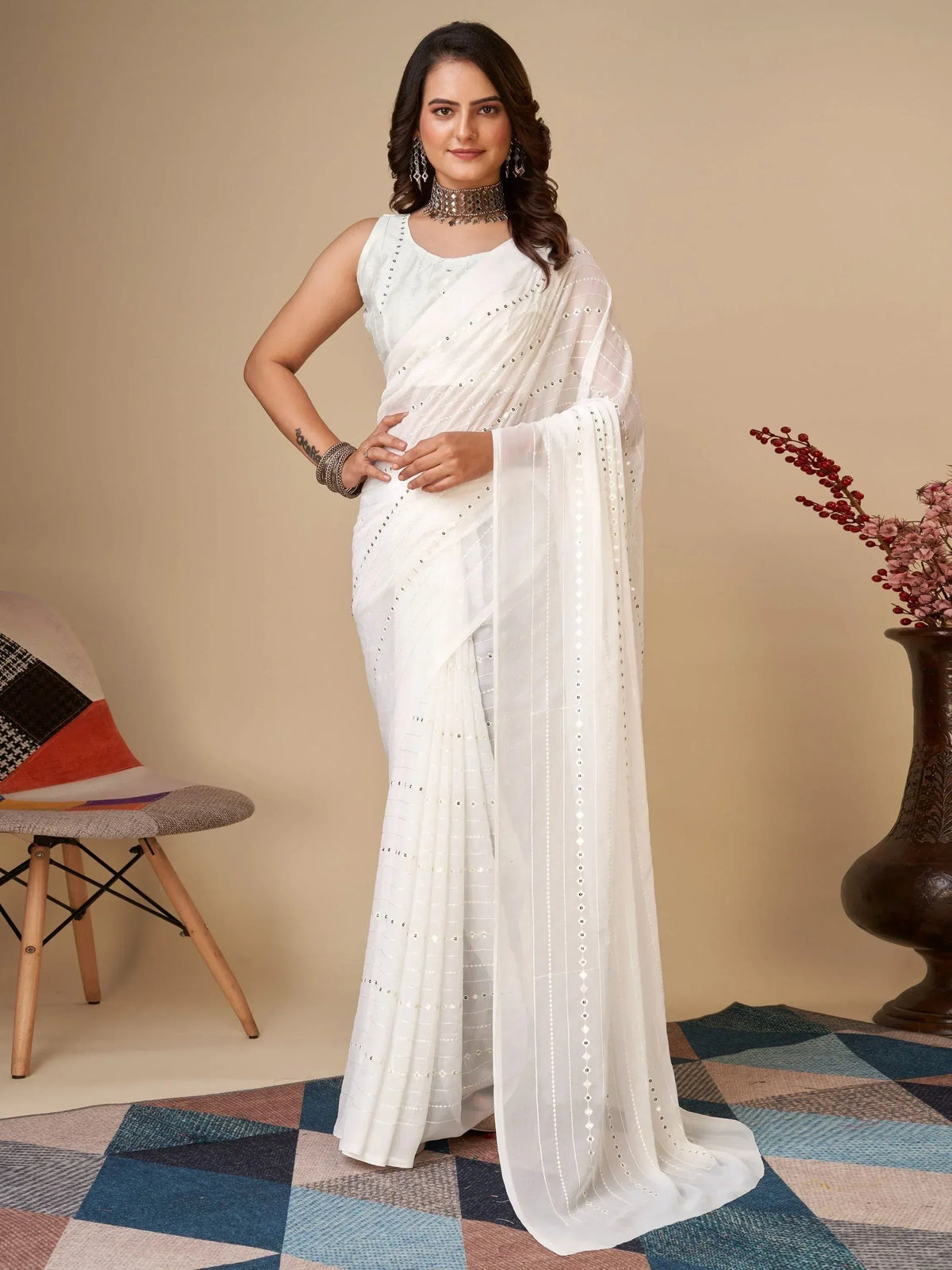 White embroidered saree with sleeveless blouse, perfect for Indian ethnic wear occasions