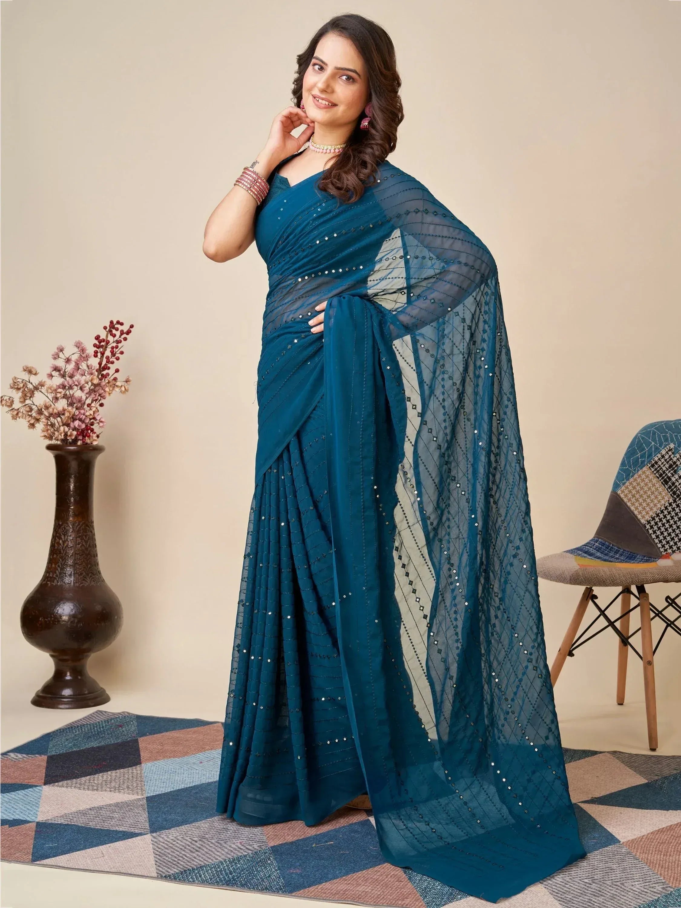 Teal blue designer saree with sequin embroidery, perfect for Indian ethnic wear occasions