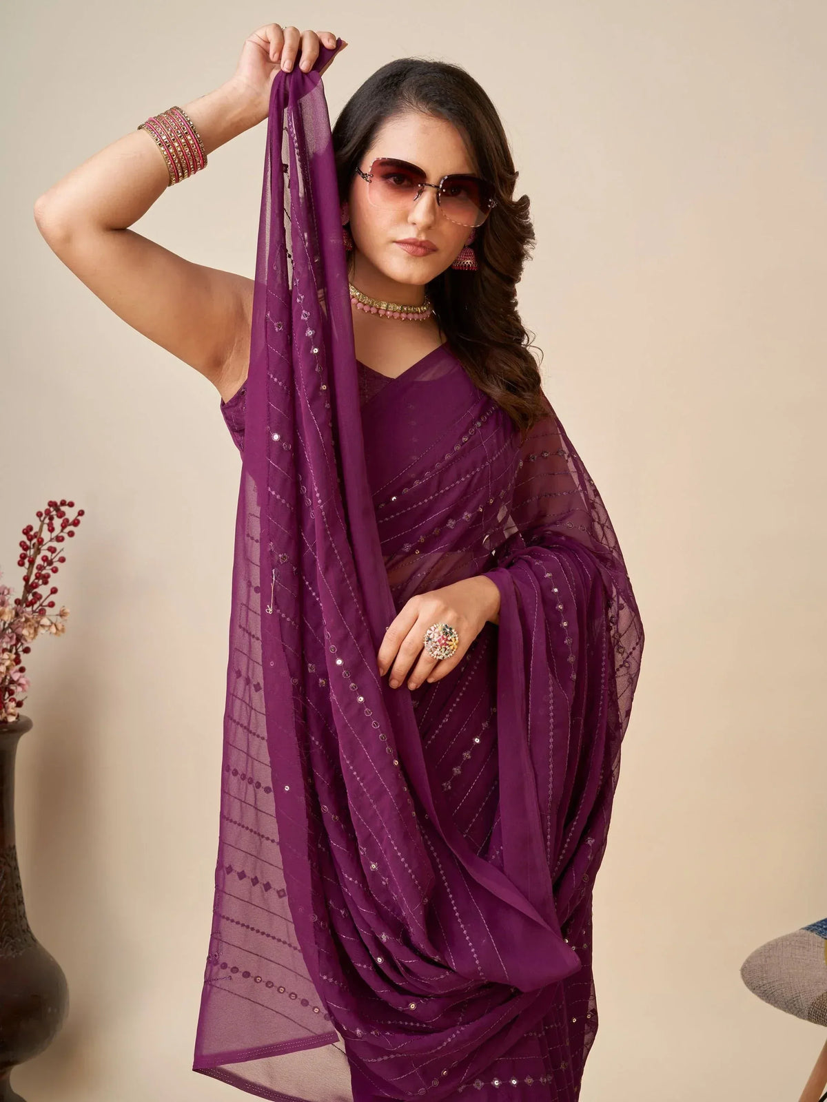Purple embroidered saree with sheer dupatta, styled with jewelry and sunglasses for ethnic fashion