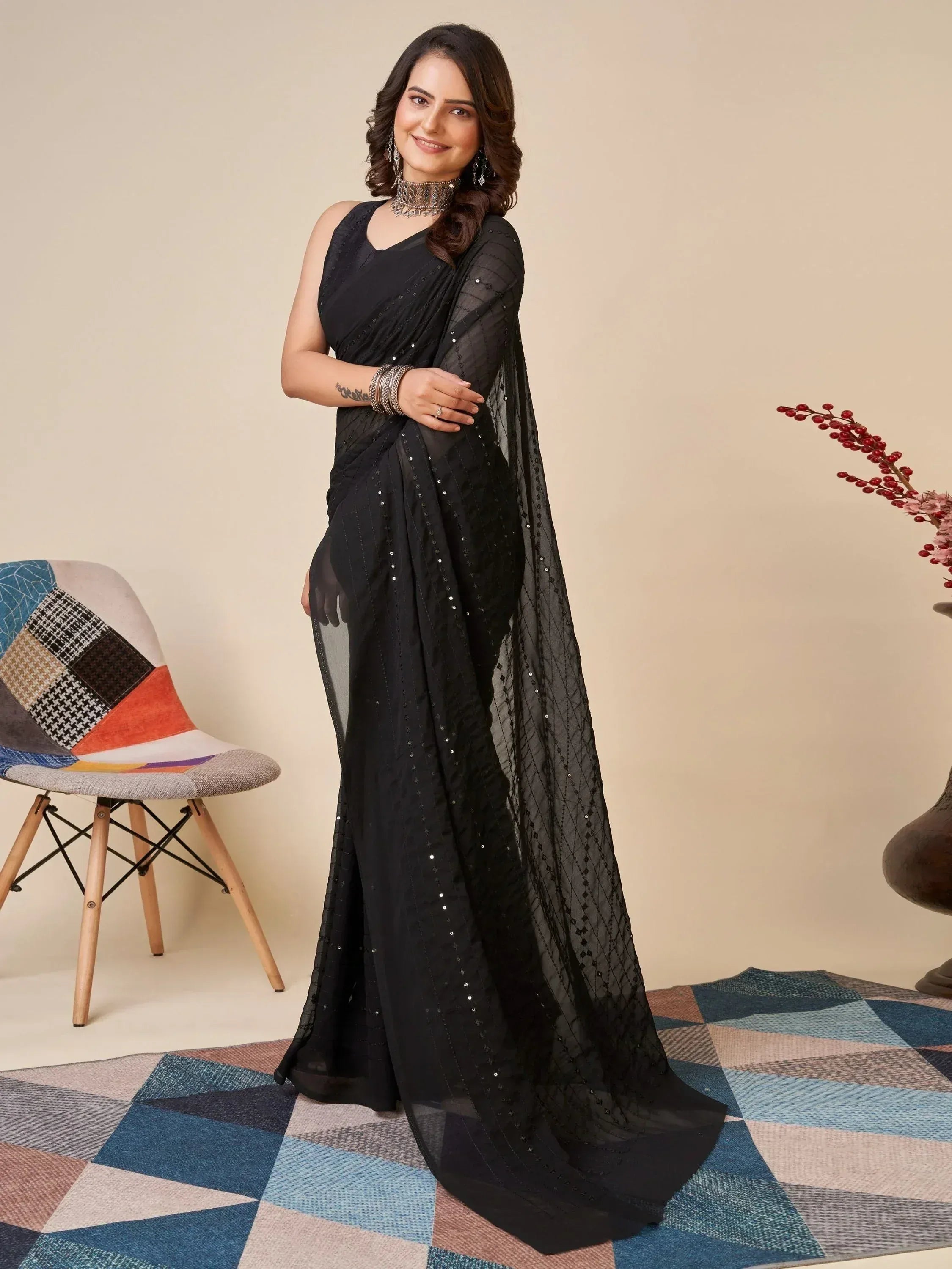 Elegant black saree with sequin embroidery, perfect for Indian ethnic wear and festive occasions.