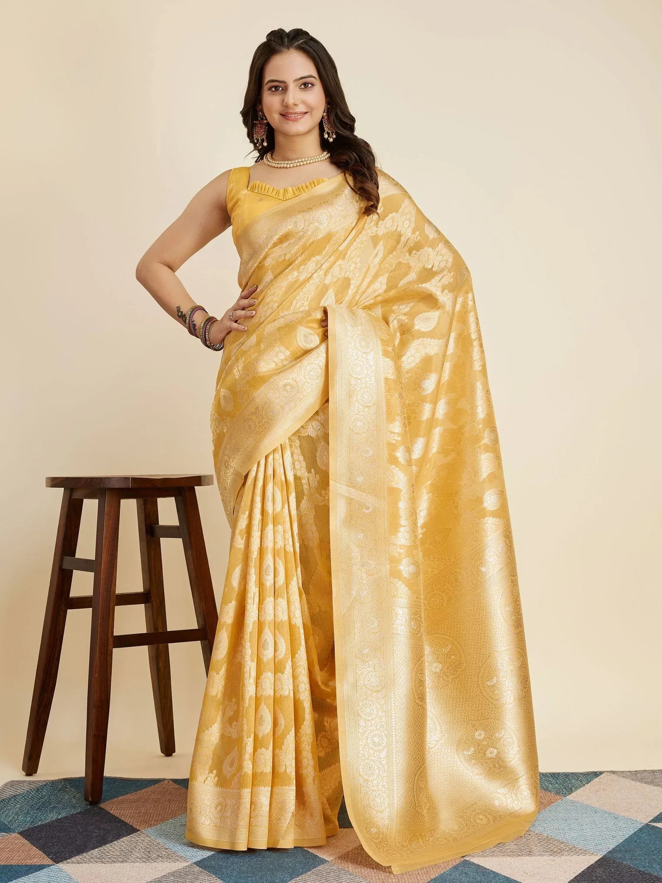 Yellow designer saree with intricate gold paisley print, perfect for Indian ethnic wear occasions