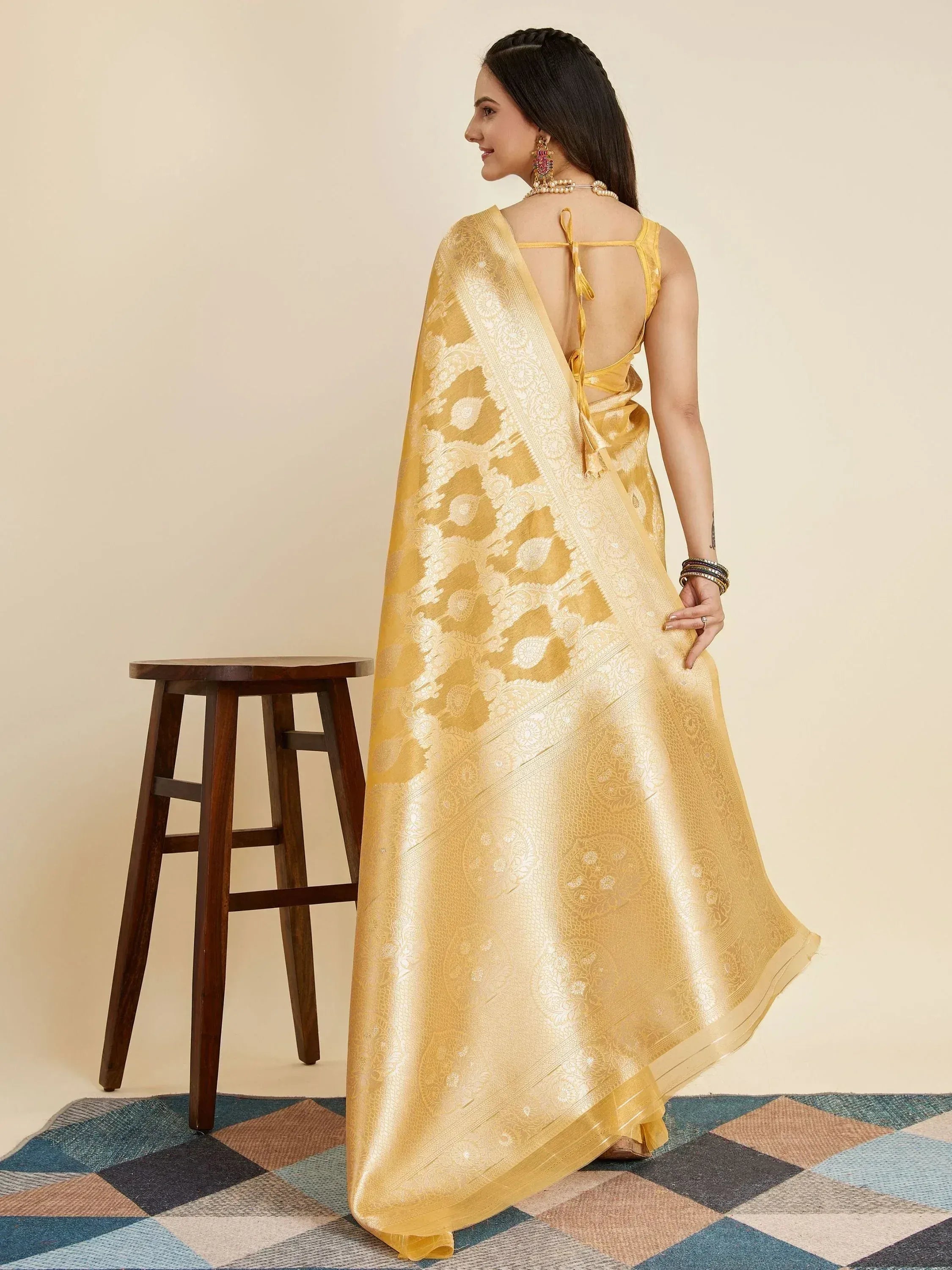 Yellow designer saree with intricate white paisley print, backless blouse, ethnic wear for women