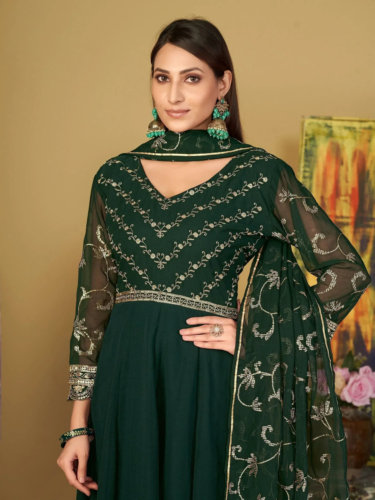 Emerald green embroidered salwar kameez with gold threadwork, sheer sleeves, and matching dupatta for Indian ethnic wear