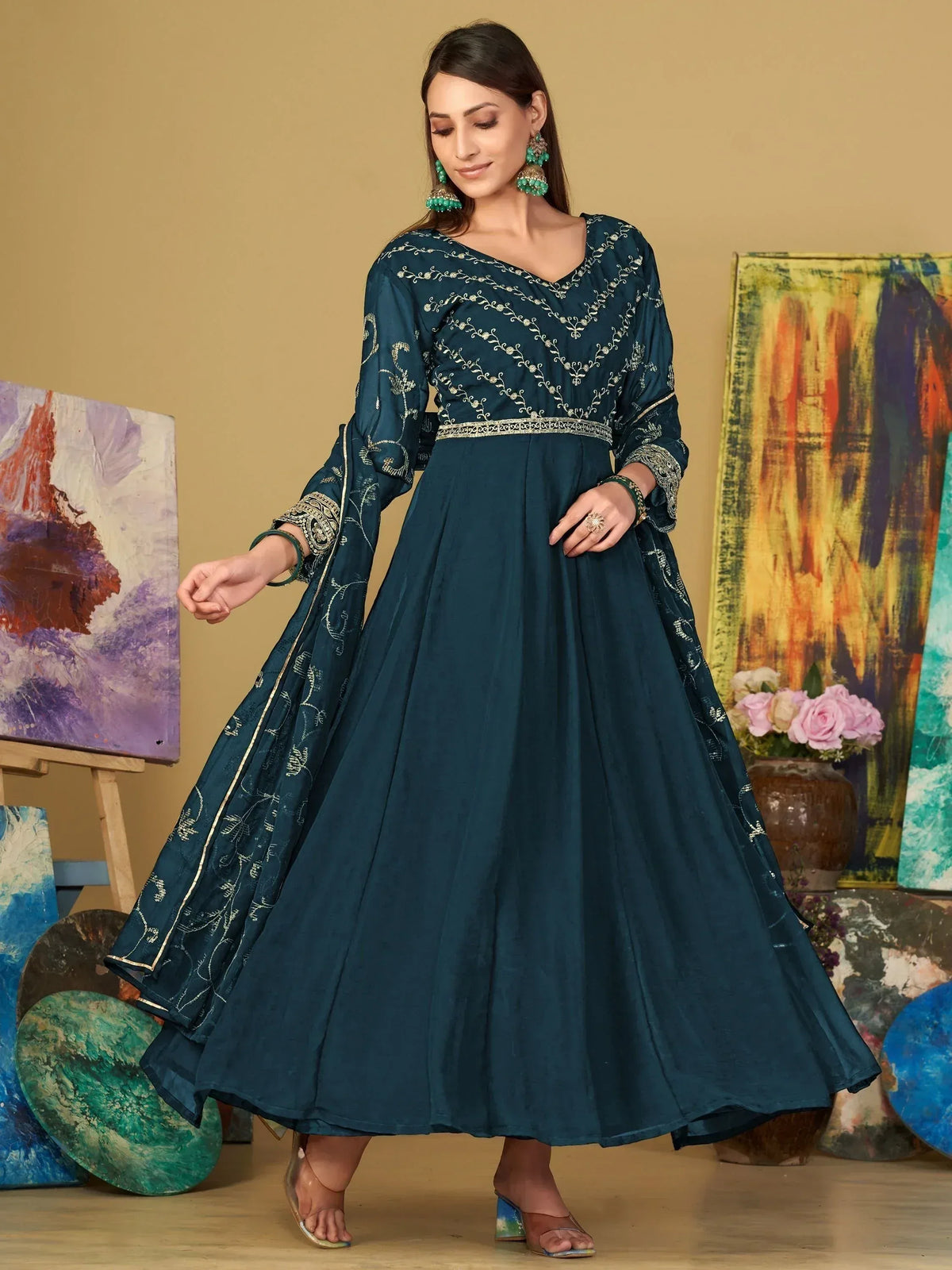 Teal embroidered anarkali gown with gold detailing, perfect for Indian ethnic wear occasions.
