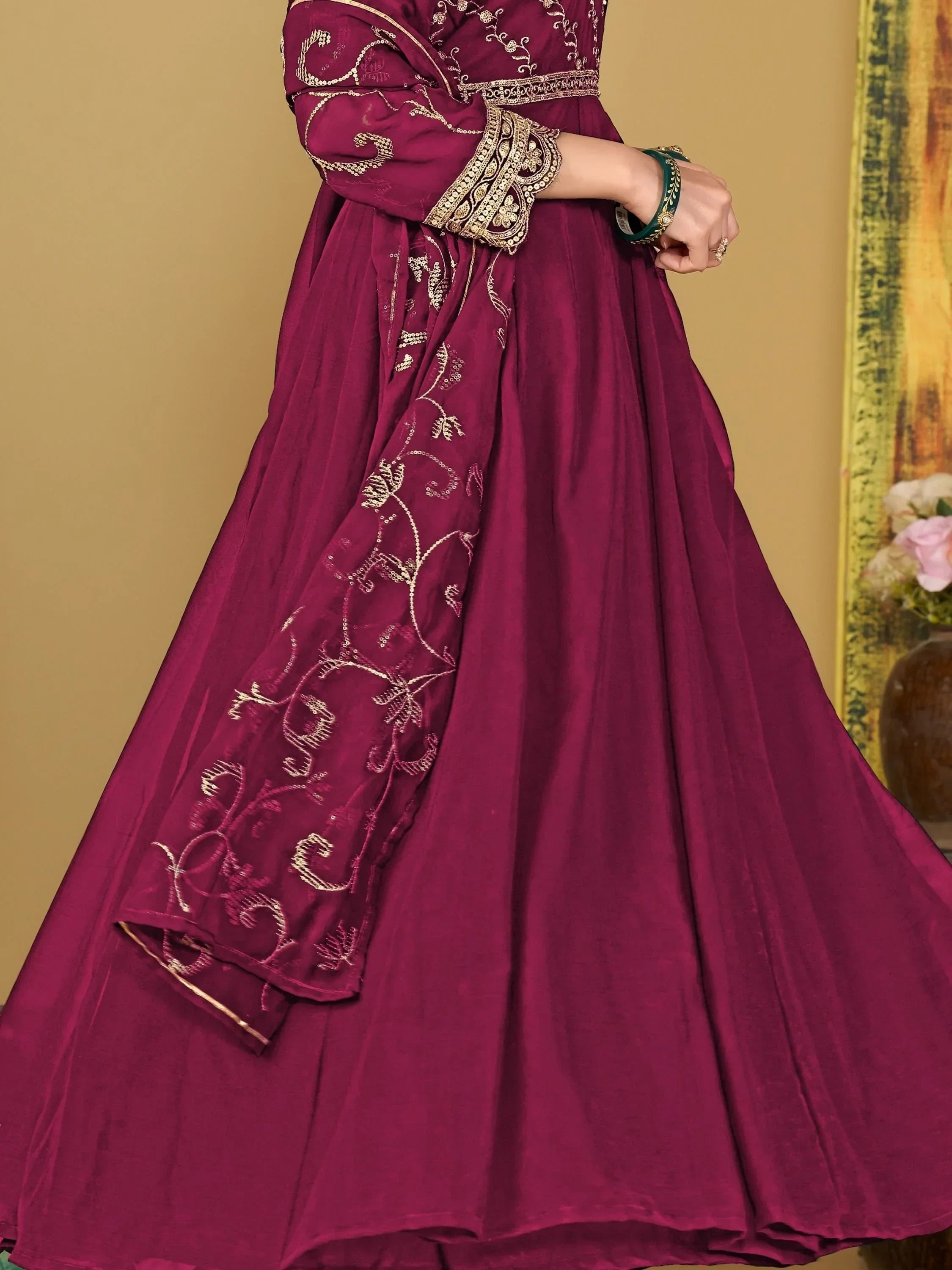 Designer maroon ethnic gown with gold embroidery and sheer dupatta