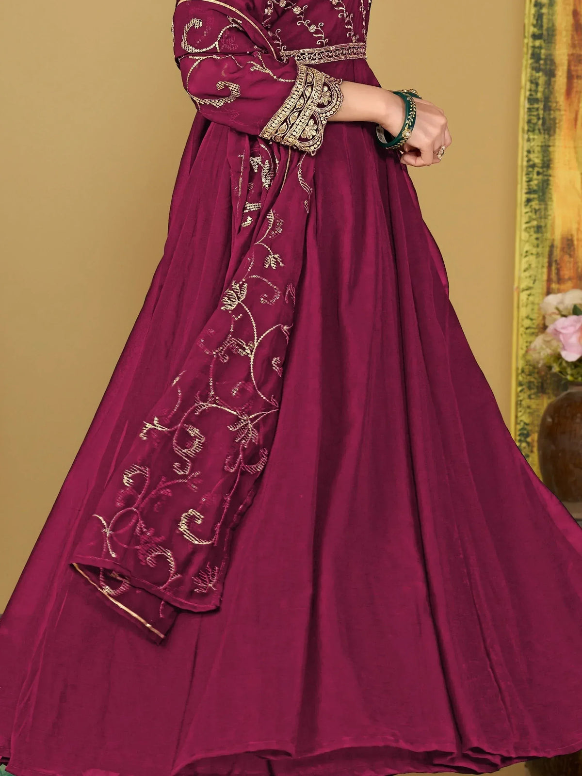 Maroon ethnic anarkali with gold embroidery and flared skirt, perfect for Indian weddings or festive occasions