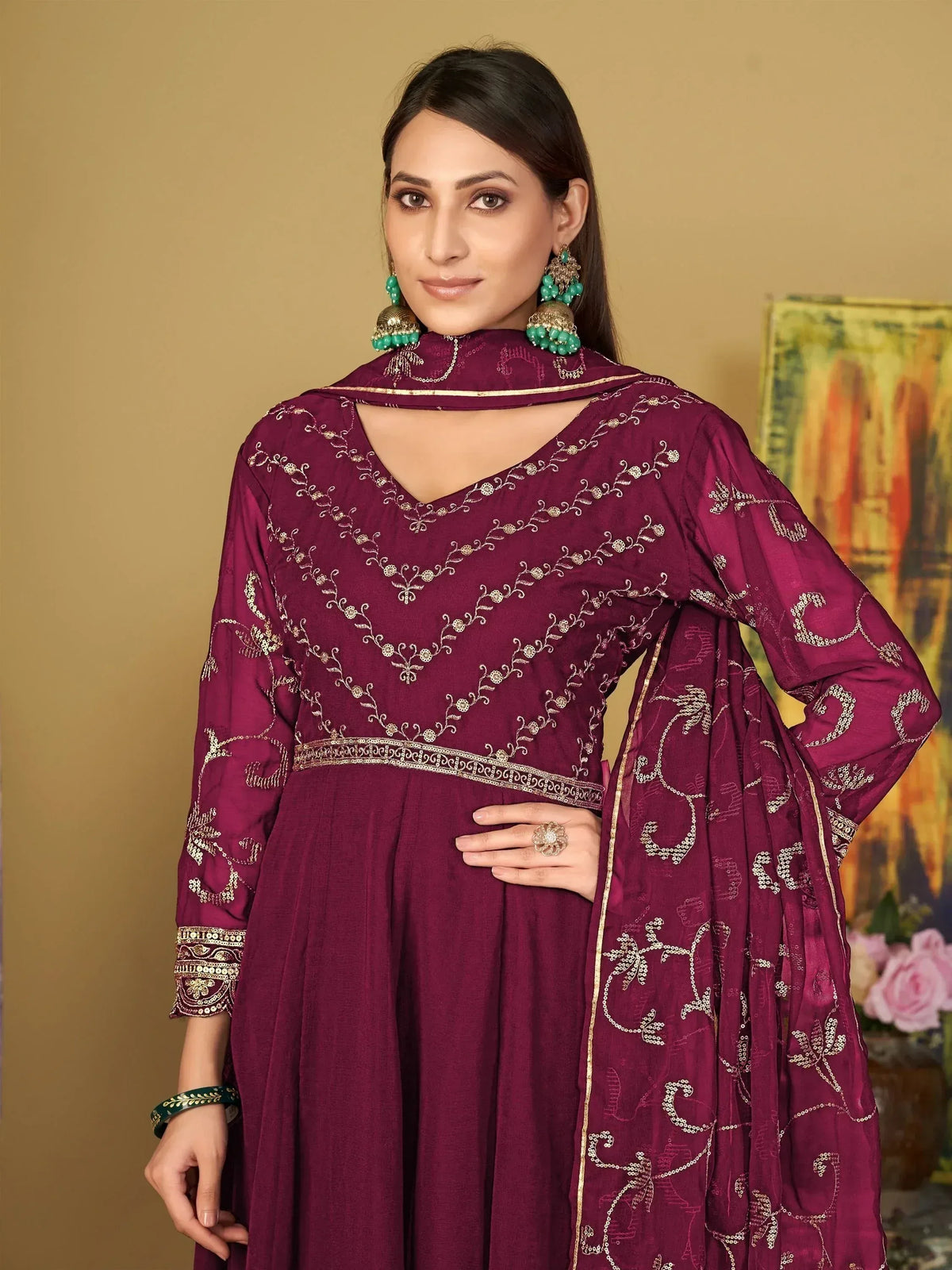 Elegant maroon salwar kameez with gold embroidery, perfect for Indian ethnic wear occasions