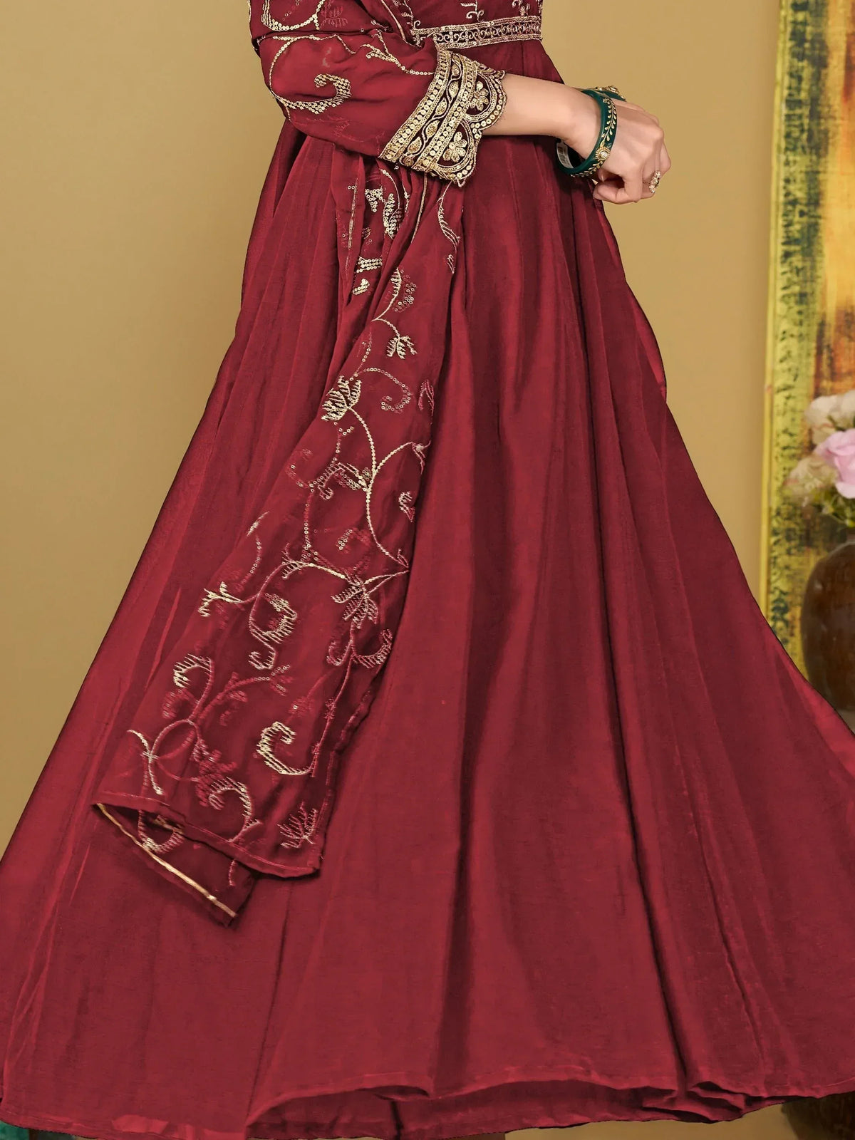 Maroon ethnic anarkali with gold embroidery and dupatta, perfect for Indian festive occasions