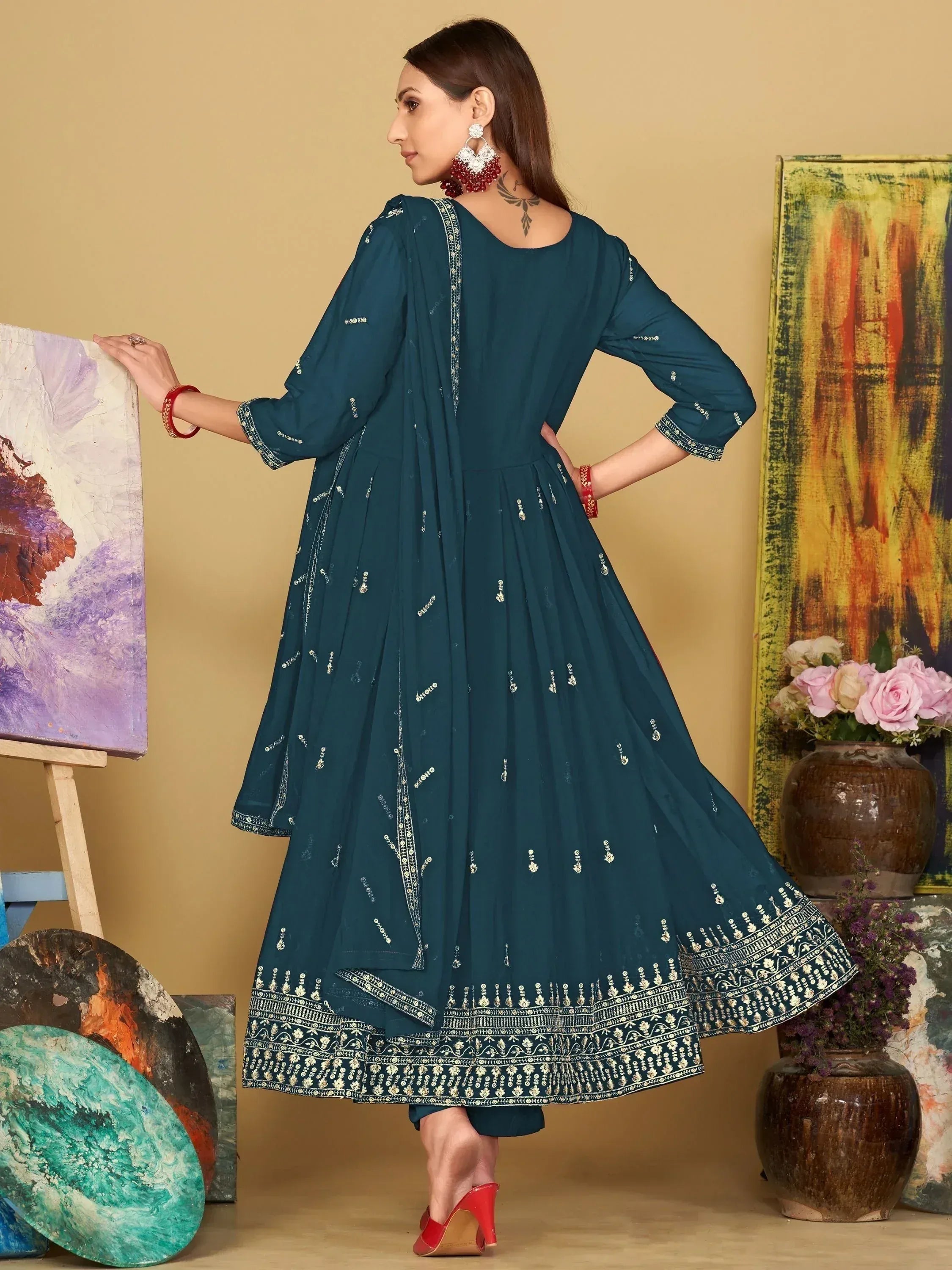 Teal ethnic anarkali gown with gold embroidery, perfect for Indian festive occasions and parties.