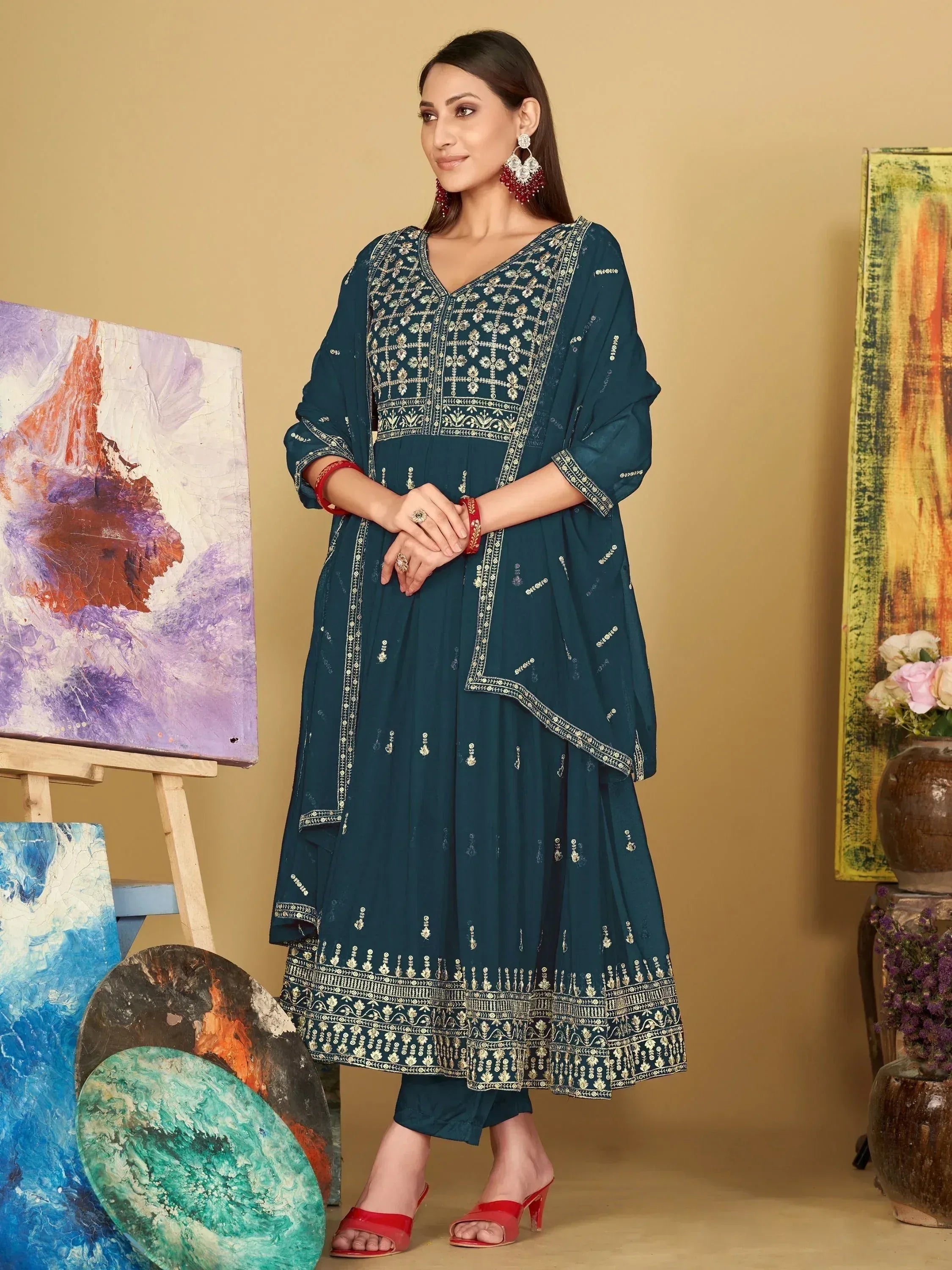 Teal embroidered ethnic salwar kameez with gold detailing and red heels