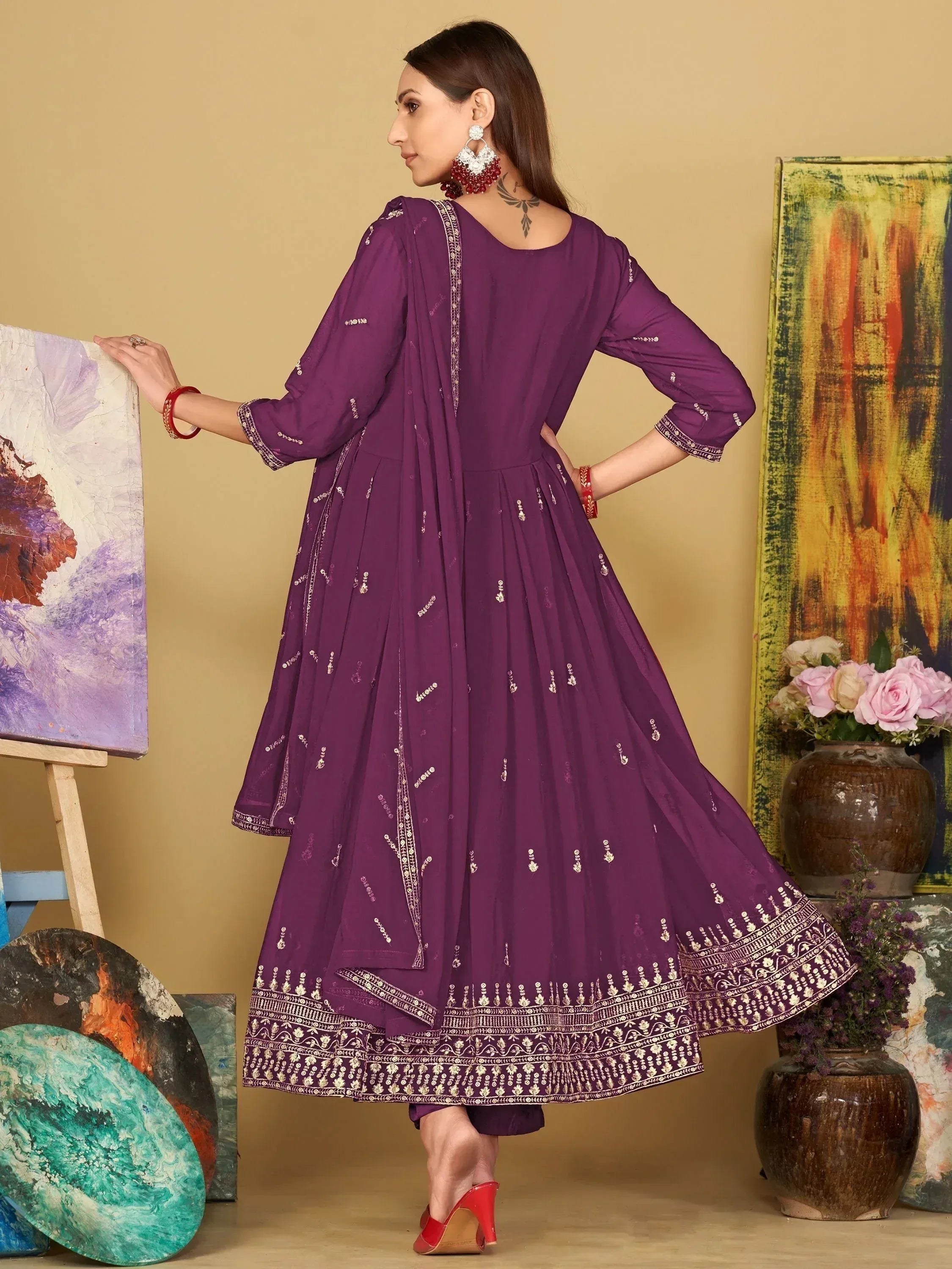 Purple embroidered anarkali suit with gold detailing, perfect for Indian ethnic wear occasions.