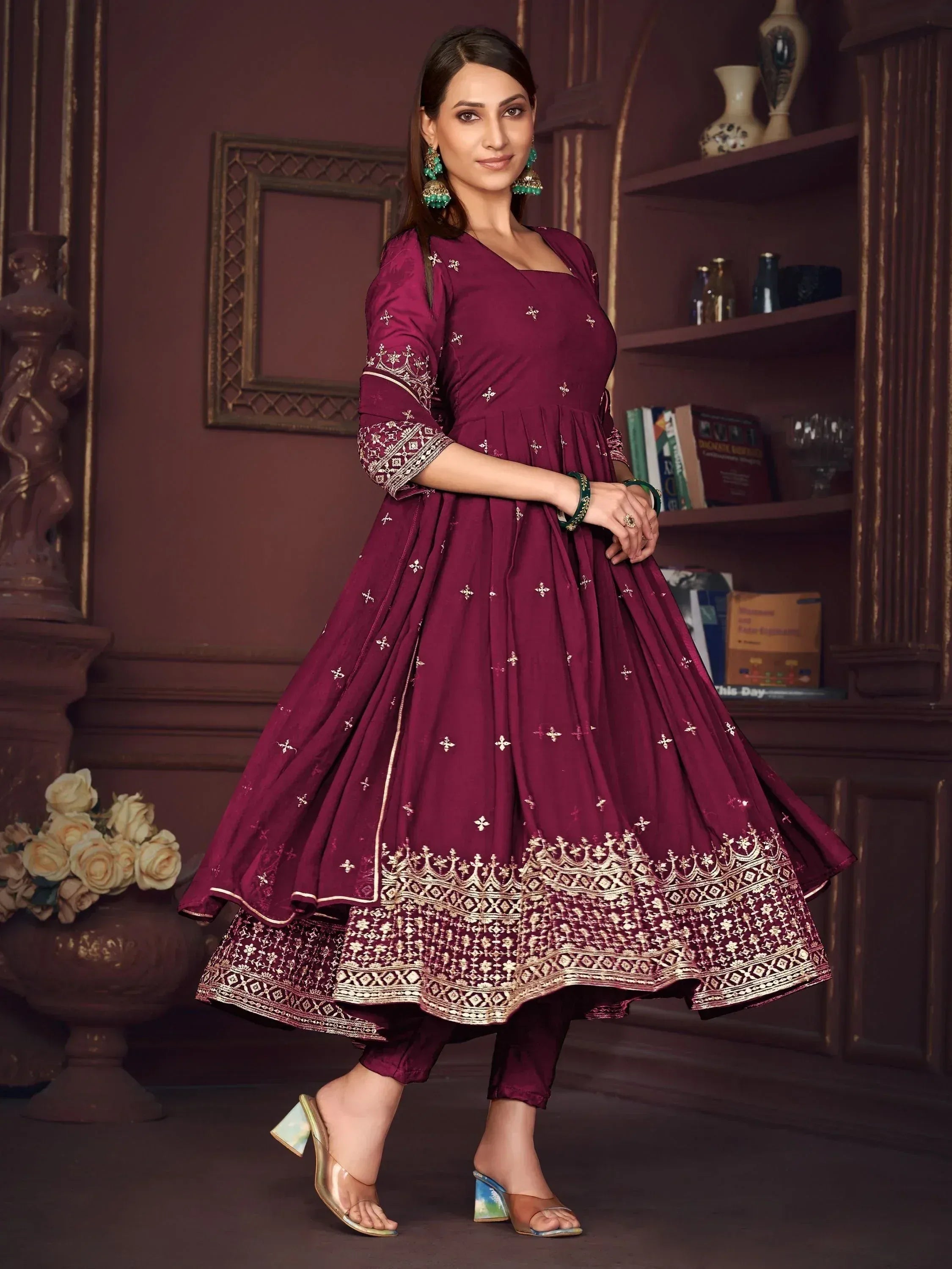 Elegant maroon anarkali suit with gold embroidery, perfect for Indian ethnic wear occasions.
