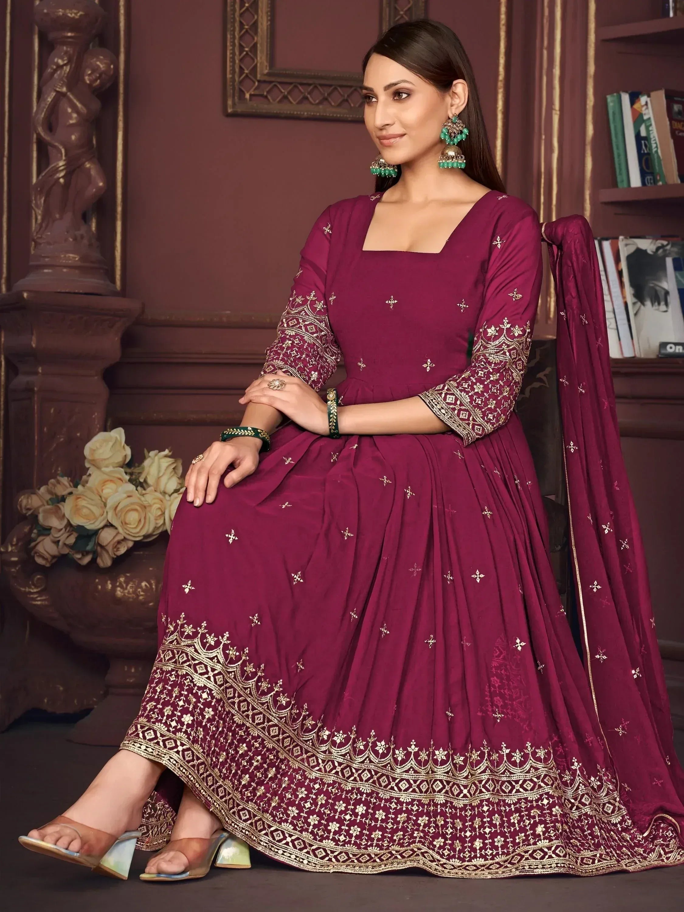 Maroon ethnic anarkali suit with gold embroidery, perfect for Indian weddings and festive occasions