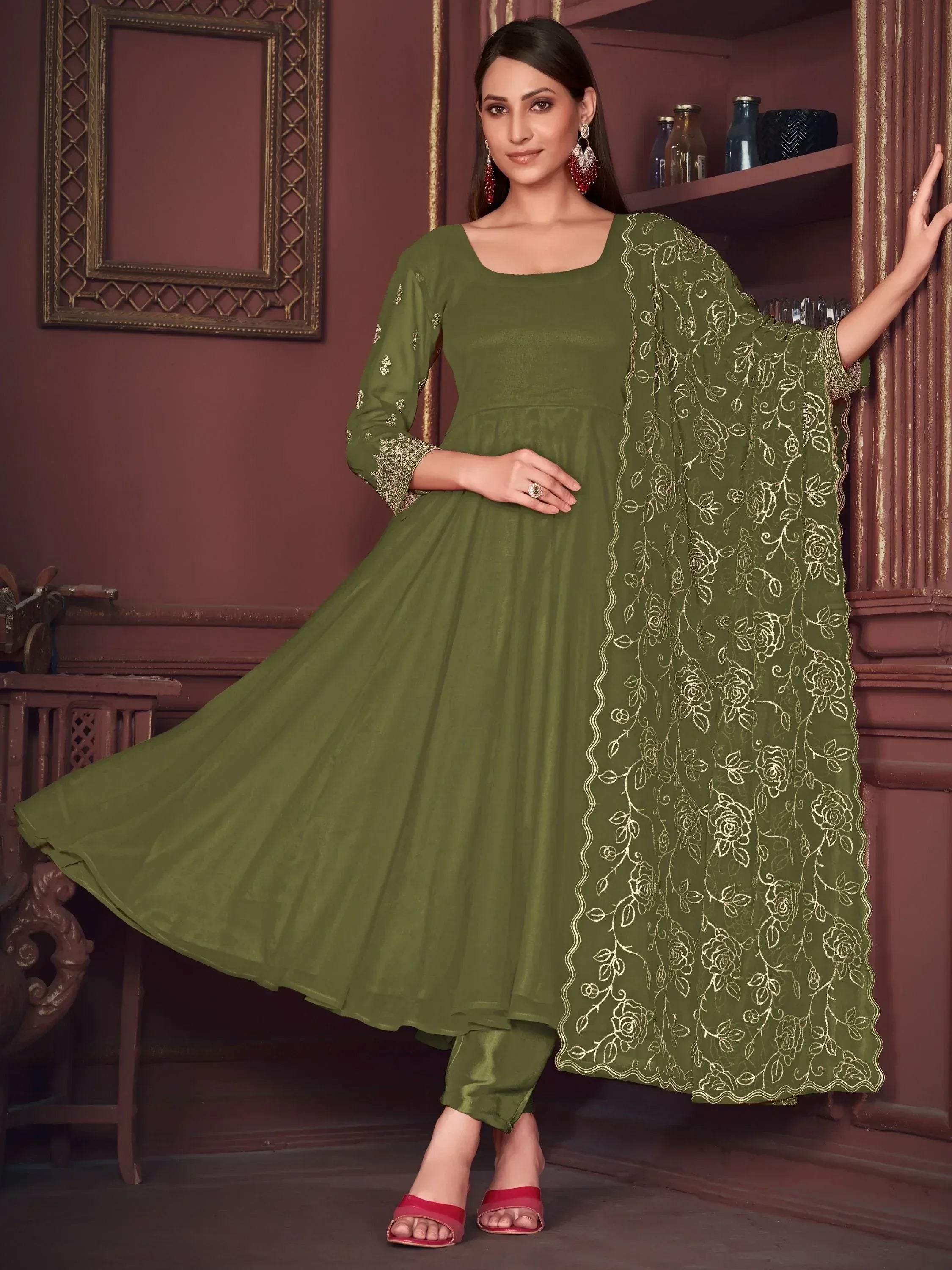 Olive green ethnic anarkali suit with gold floral embroidery and matching dupatta, perfect for festive occasions.