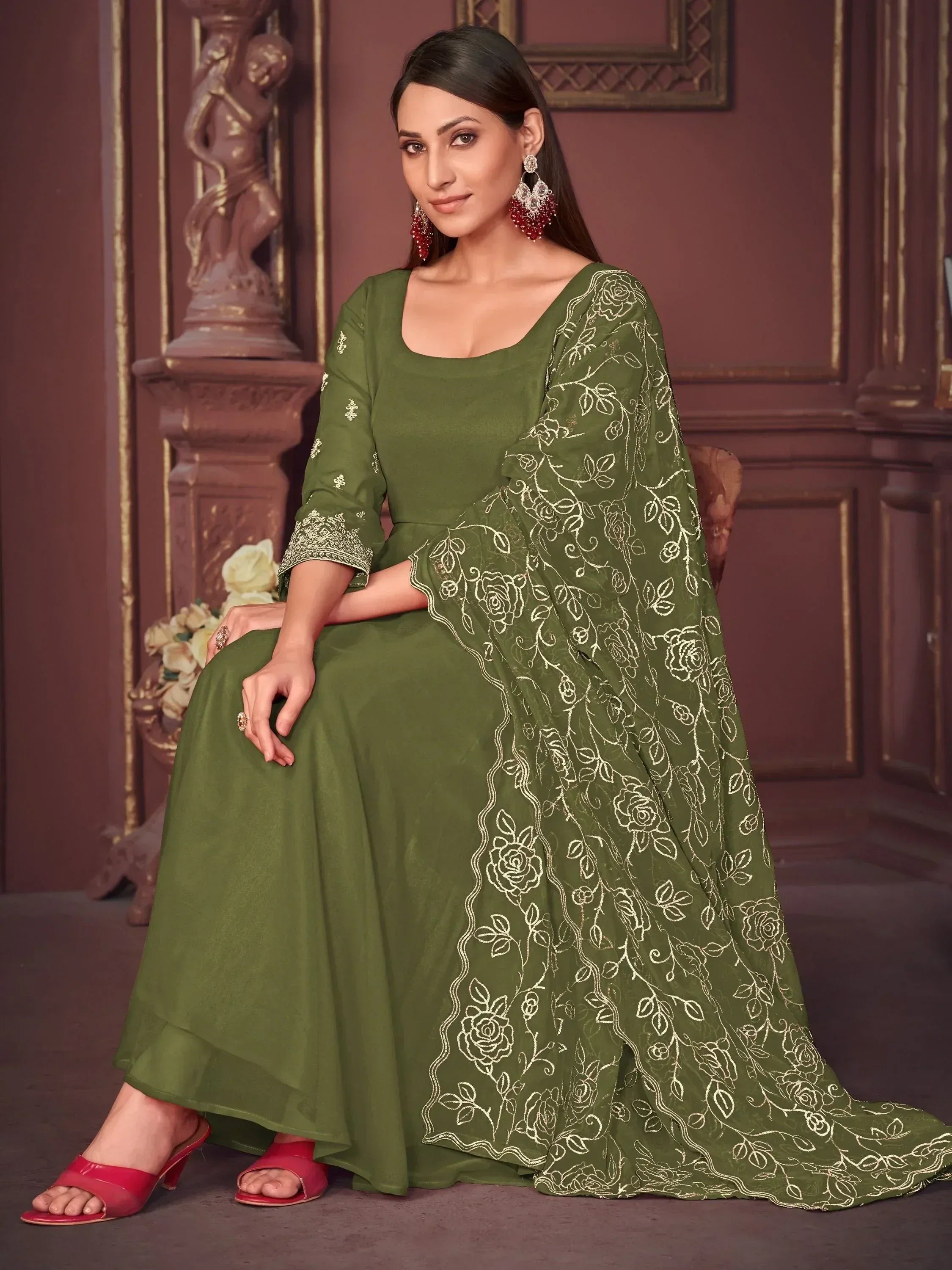 Olive green ethnic gown with gold floral embroidery, perfect for Indian occasions and festive wear.