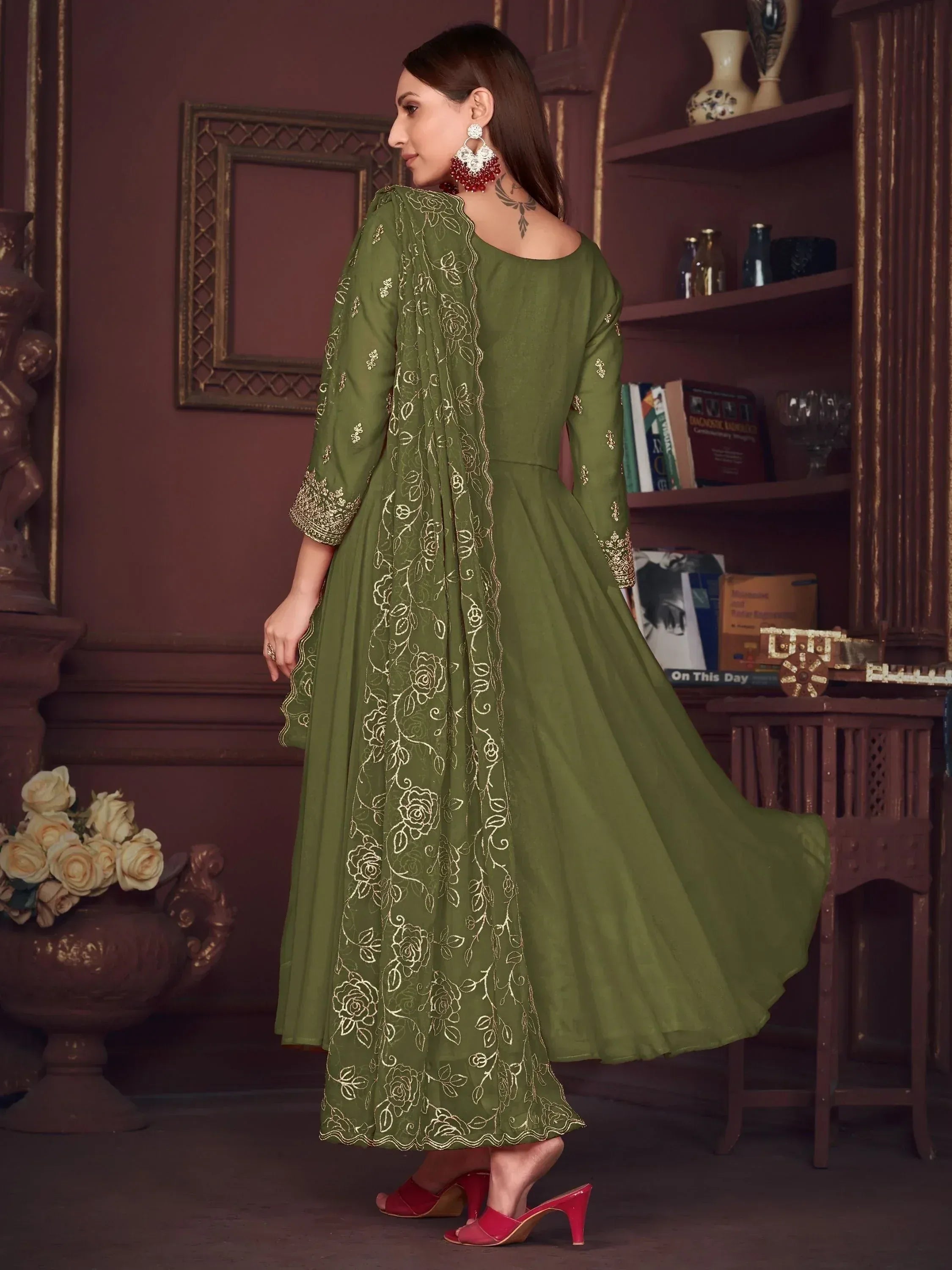 Olive green ethnic gown with gold floral embroidery, perfect for Indian occasions and festive wear.