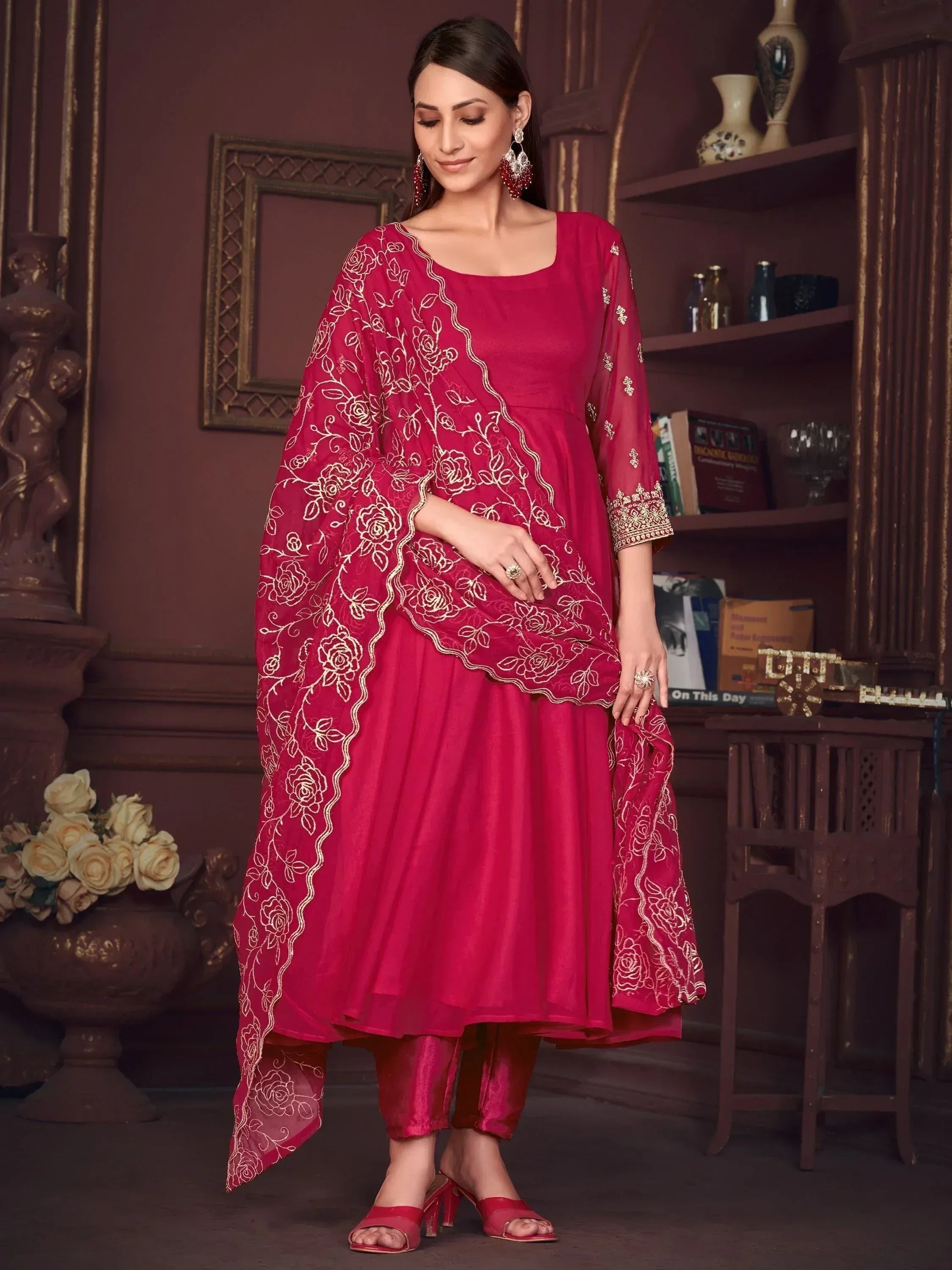 Red ethnic salwar kameez with gold floral embroidery, perfect for Indian occasions and festive wear.
