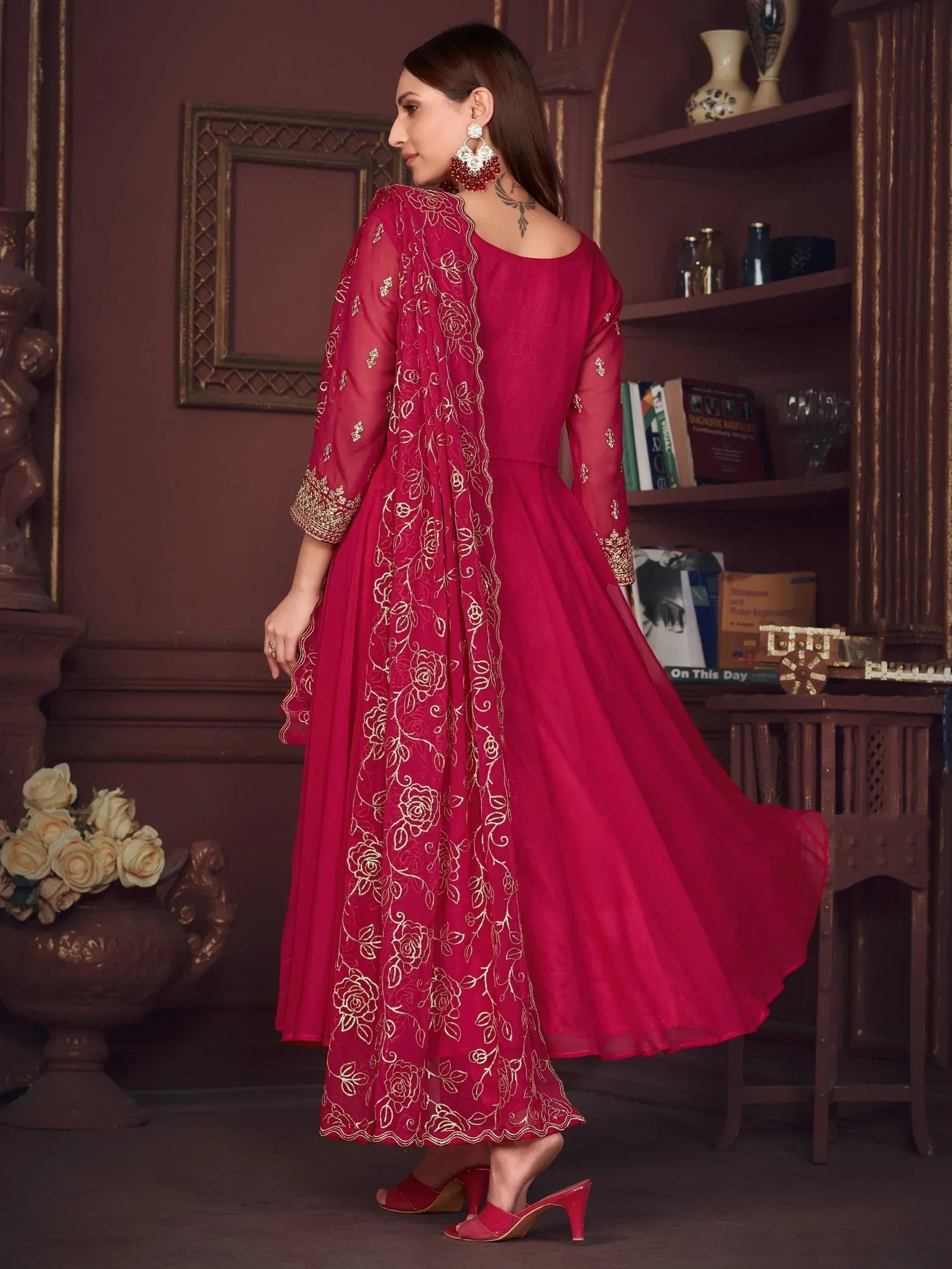 Red ethnic gown with gold floral embroidery, perfect for Indian occasions and festive wear