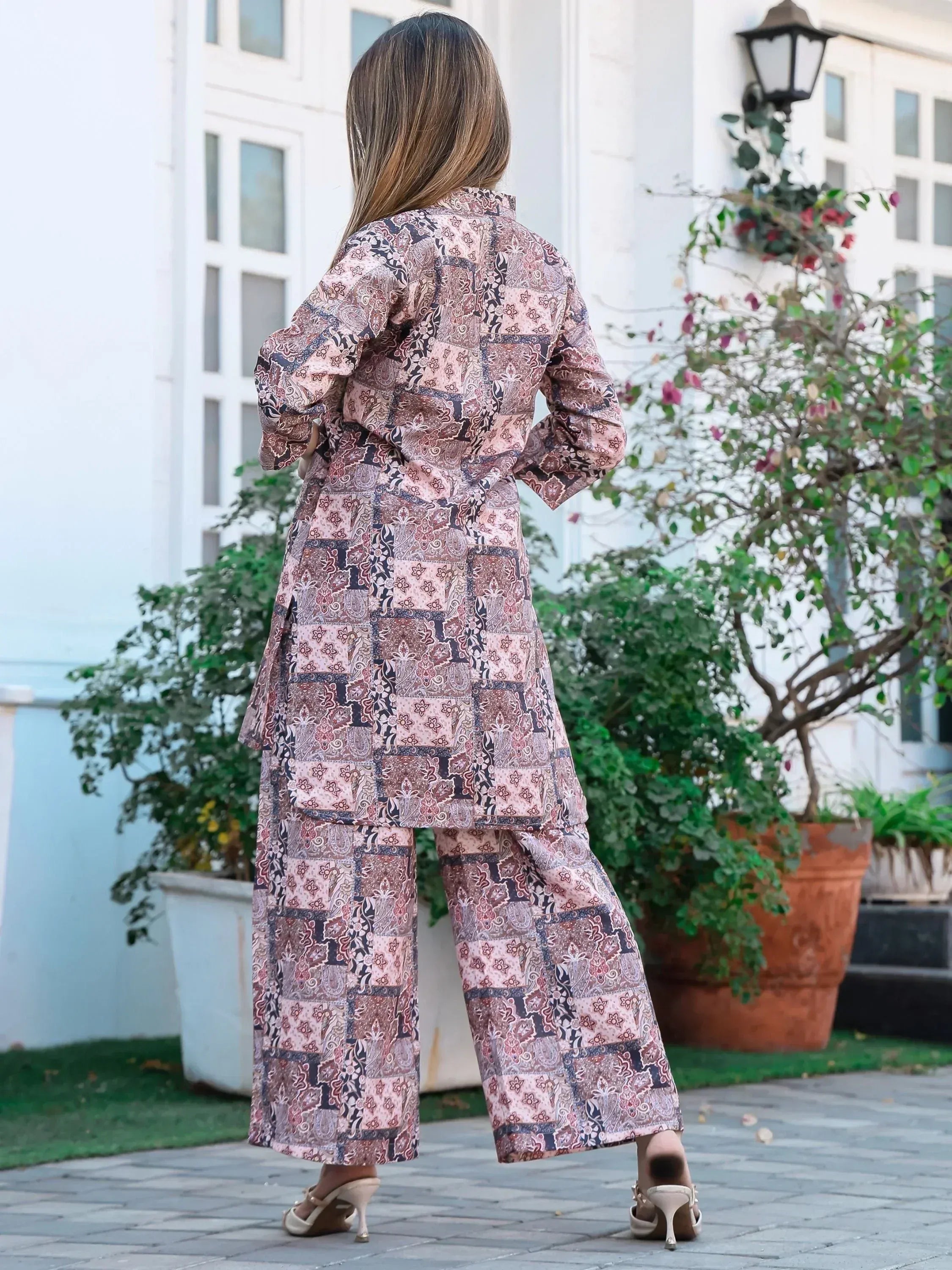 Woman in printed ethnic kurta set with wide pants, perfect for Indian festive occasions