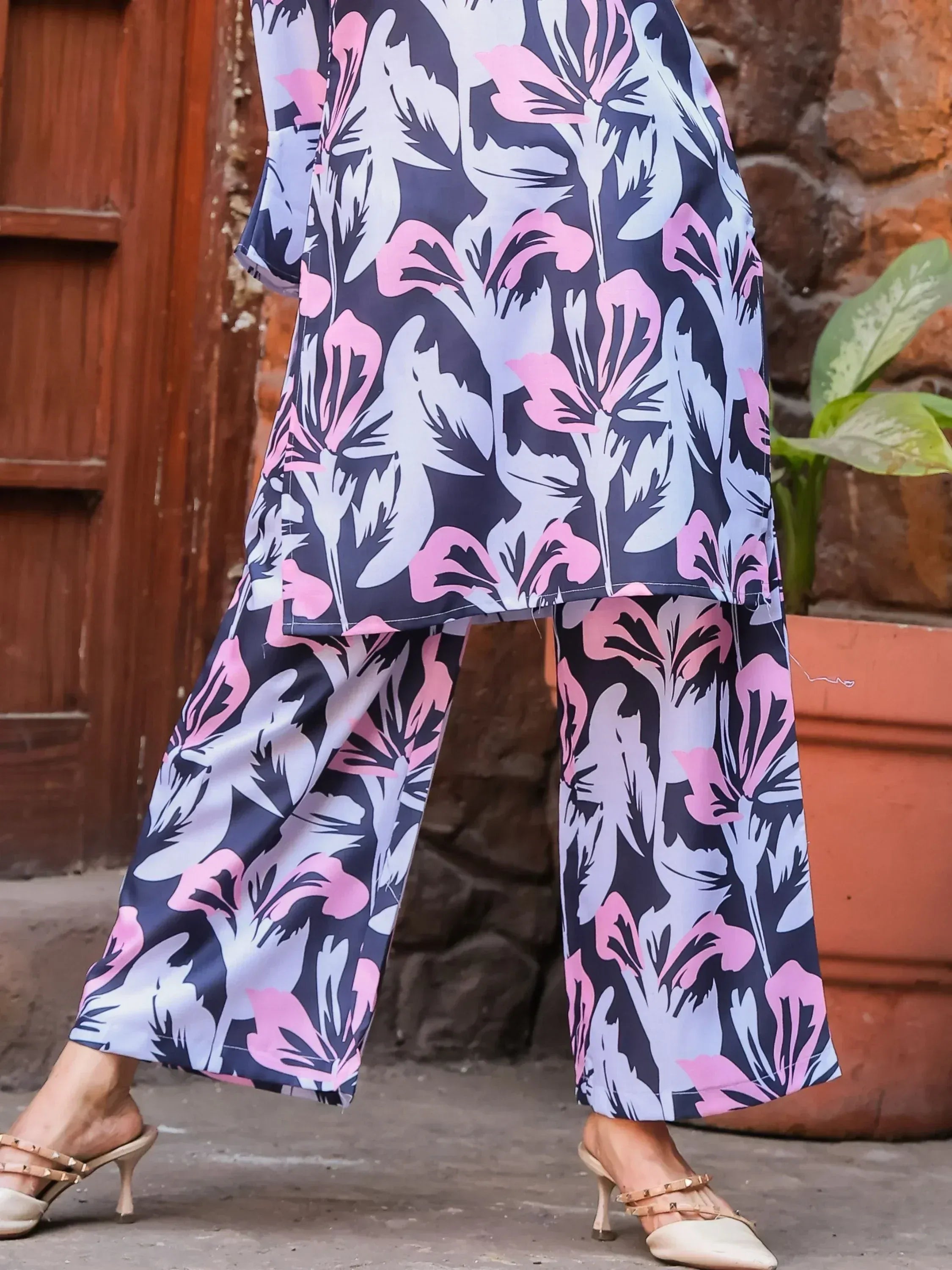 Floral print ethnic kurta with wide pants, pink and white blooms on navy, styled with heels