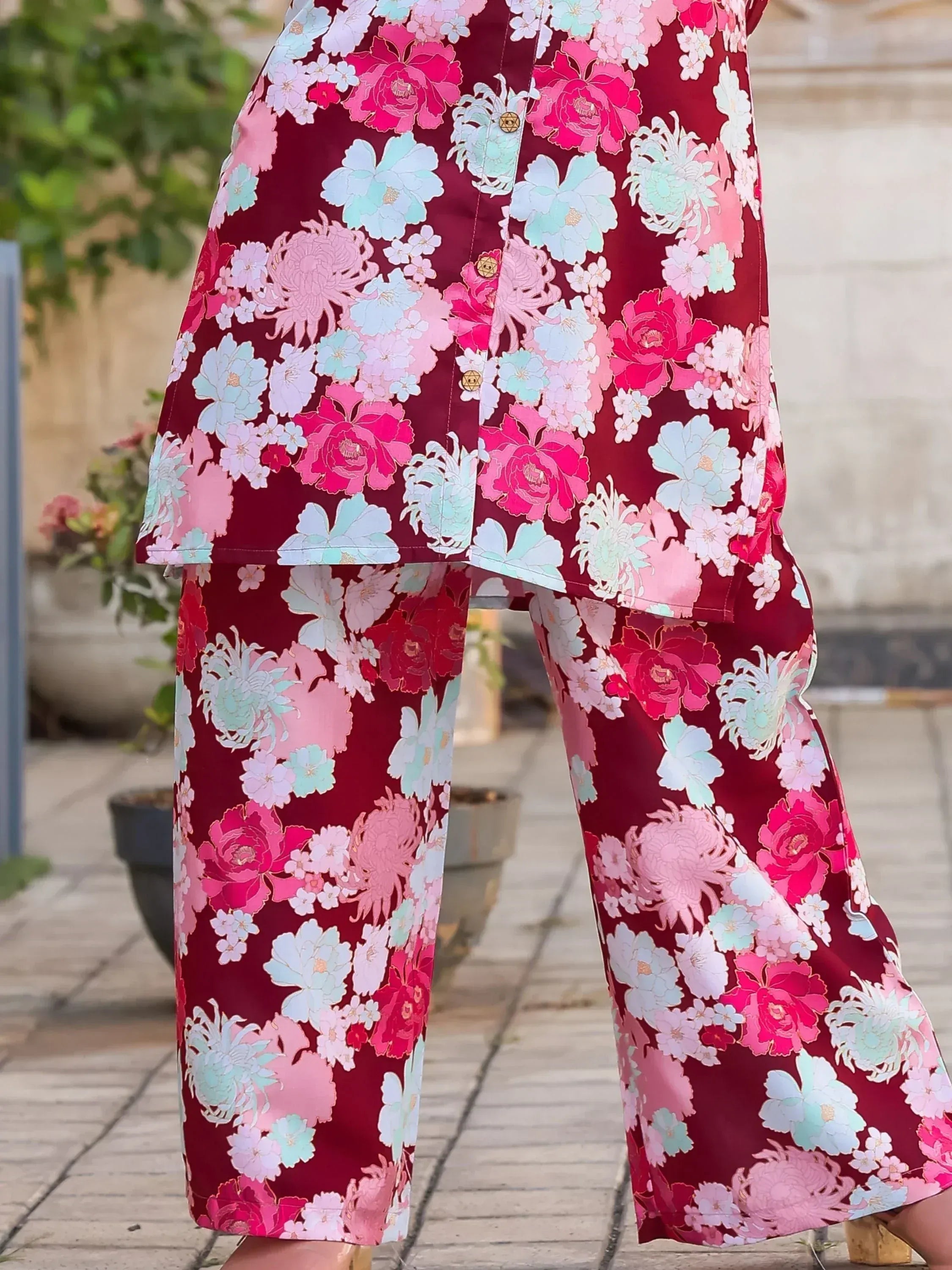Floral print ethnic kurta with wide pants, vibrant pink and blue flowers on maroon background