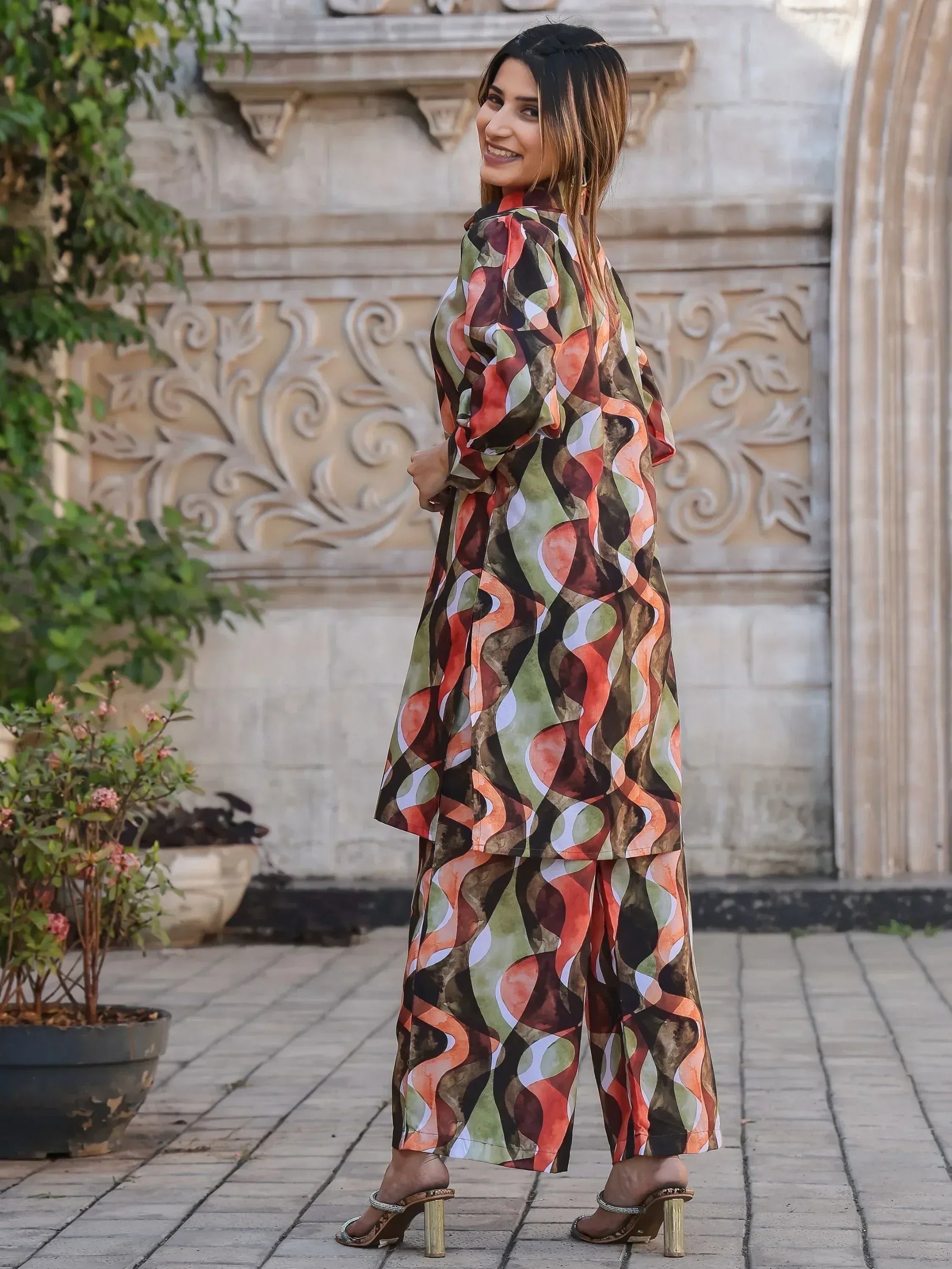 Woman in printed ethnic kurta set with wide pants, perfect for Indian festive occasions