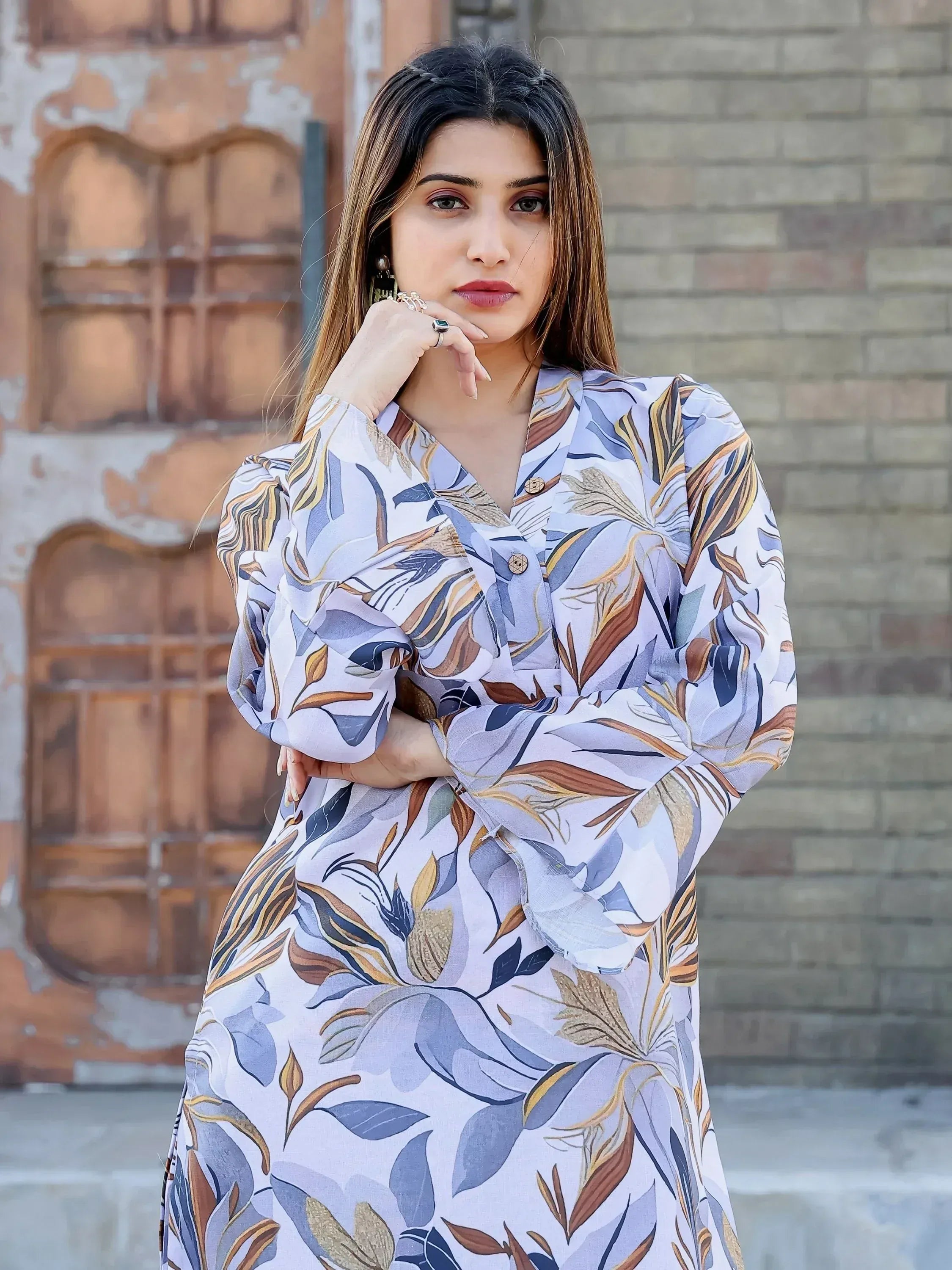 Woman in floral print ethnic kurta with puff sleeves, stylish Indian wear for women