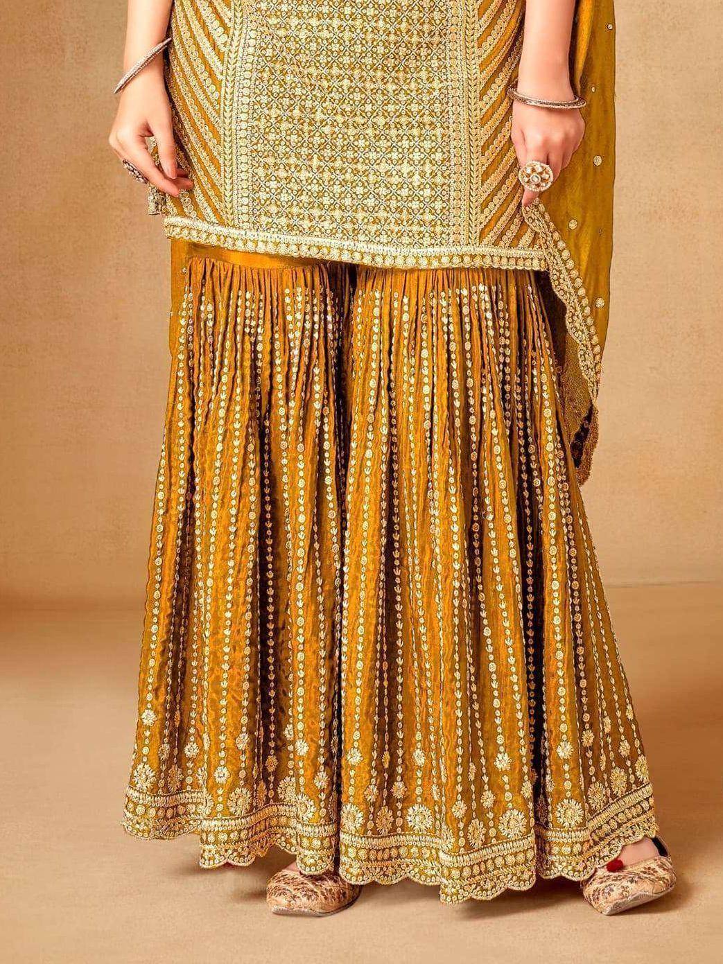 Golden embroidered lehenga choli with intricate thread work, perfect for Indian ethnic wear occasions