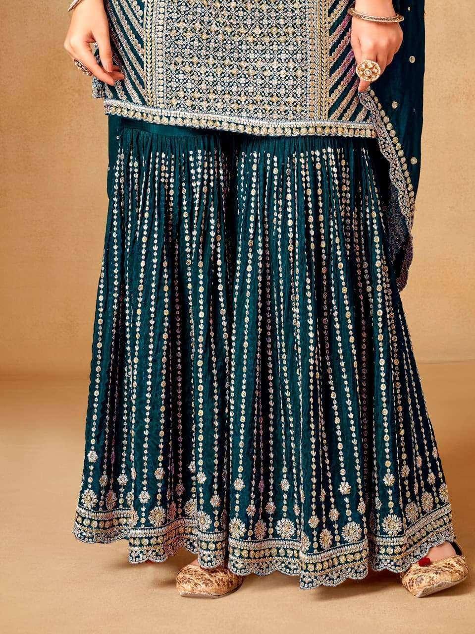 Elegant teal embroidered lehenga choli with intricate gold detailing and matching footwear