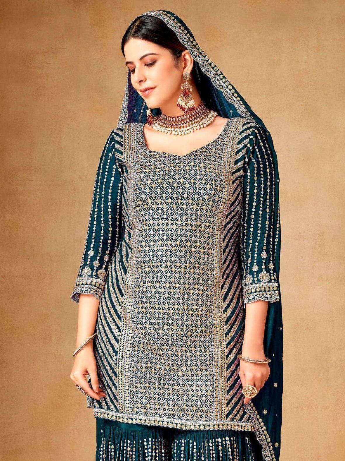 Elegant teal embroidered salwar kameez with matching dupatta and jewelry