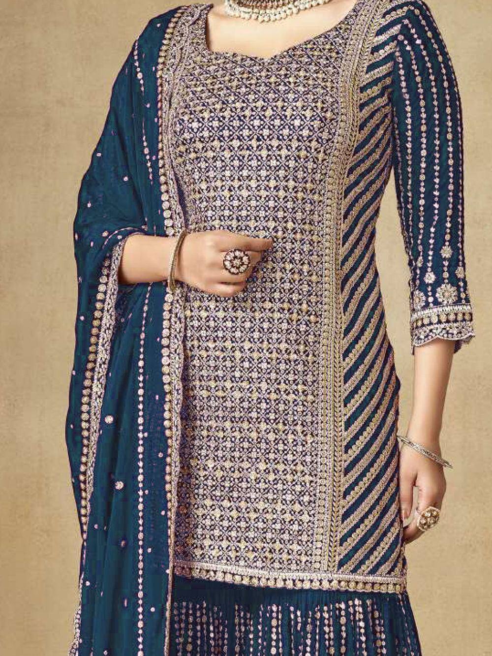 Elegant navy blue embroidered salwar kameez with intricate gold patterns and matching dupatta, perfect for festive occasions.