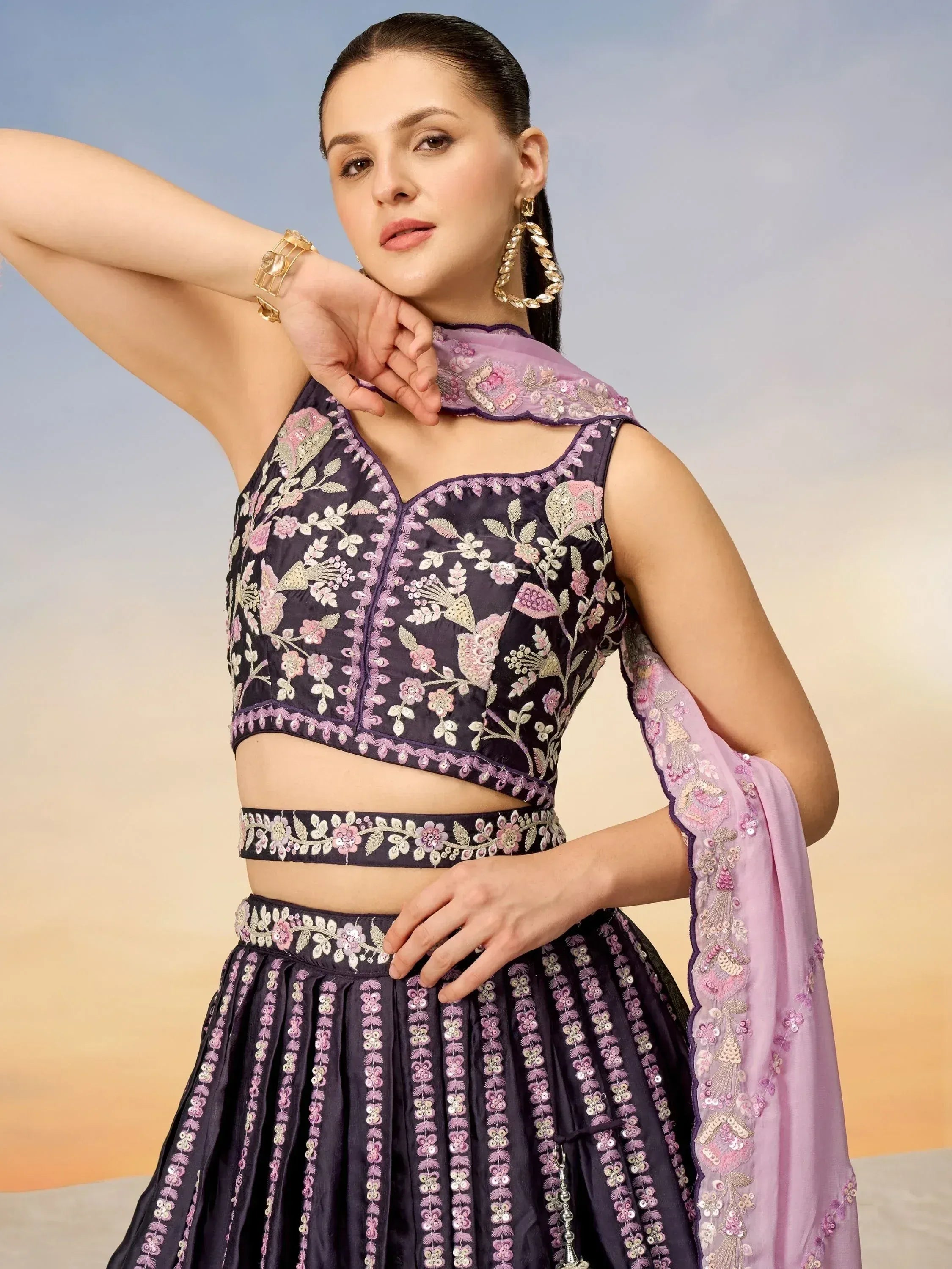 Elegant purple lehenga choli with floral embroidery and matching dupatta, perfect for Indian ethnic occasions.