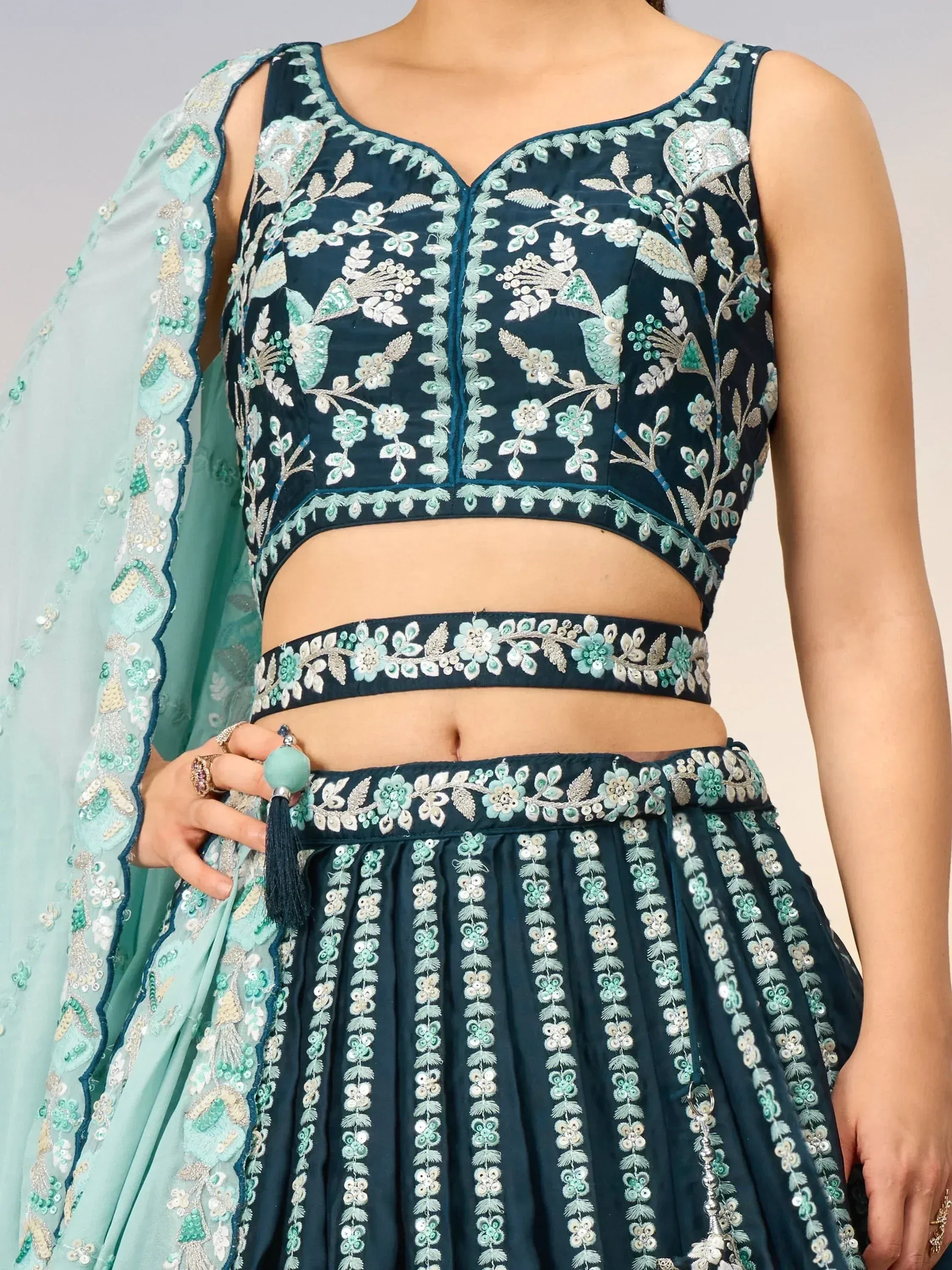 Teal embroidered lehenga choli with floral motifs and matching dupatta, Indian ethnic wear