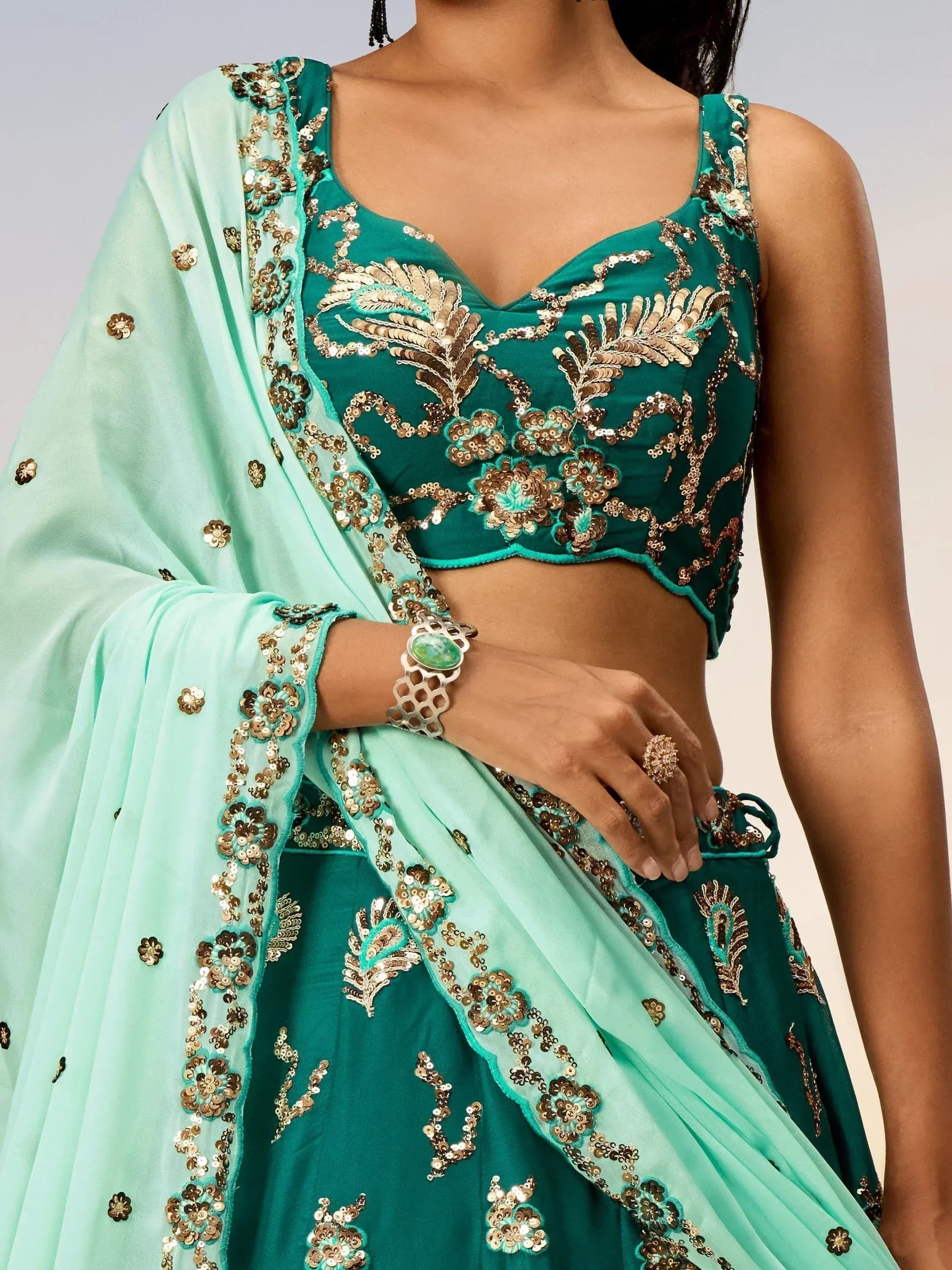 Emerald green designer lehenga choli with gold sequin embroidery and mint dupatta, ethnic Indian wear